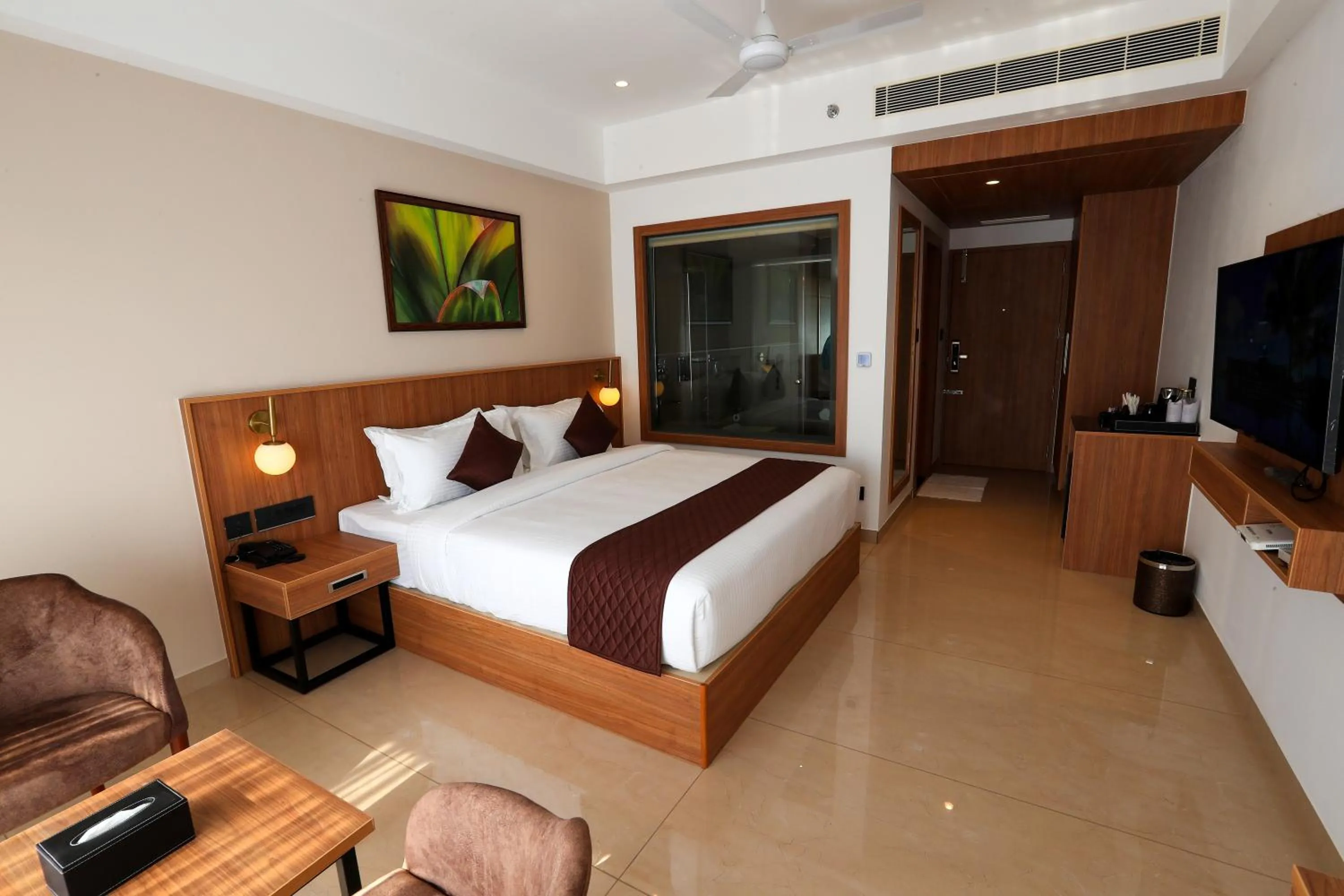 Photo of the whole room, Bed in Hotel Saffron Wayanad