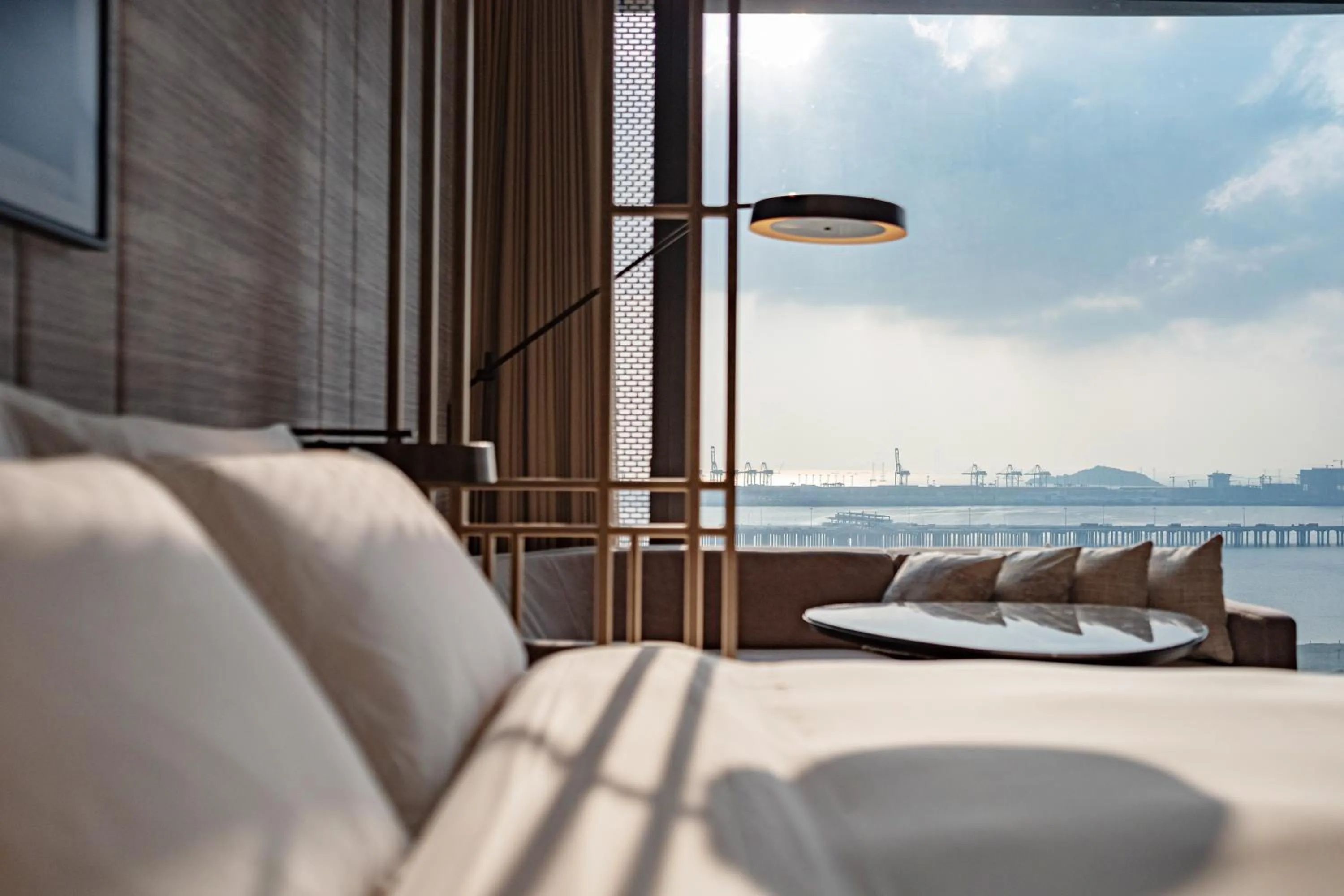 Bedroom, Bed in Conrad Shenzhen, the first art museum hotel in Greater Bay Area with the stunning bay and sunset view in the hotel terrace