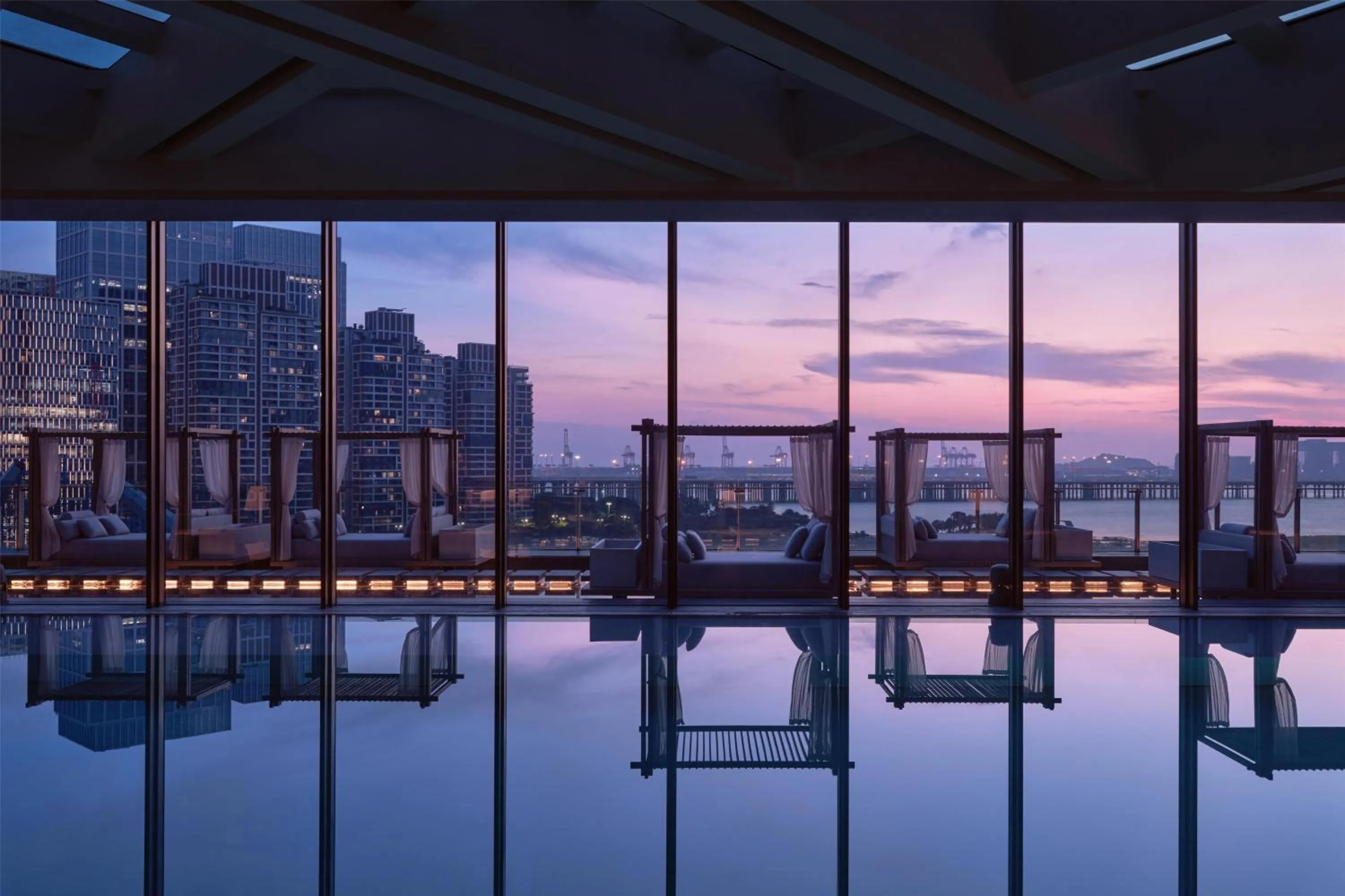 Pool view in Conrad Shenzhen, the first art museum hotel in Greater Bay Area with the stunning bay and sunset view in the hotel terrace
