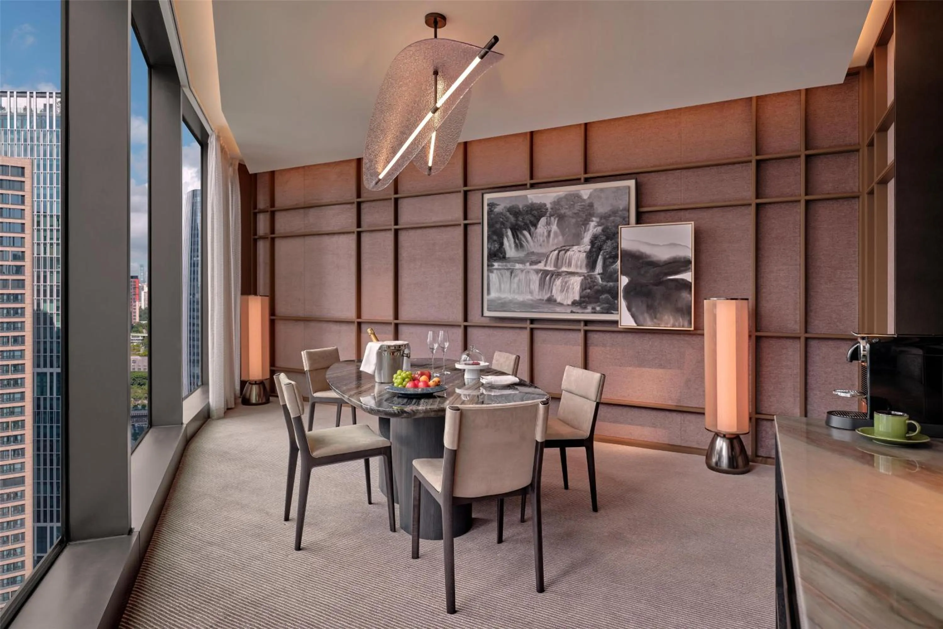 Living room in Conrad Shenzhen, the first art museum hotel in Greater Bay Area with the stunning bay and sunset view in the hotel terrace