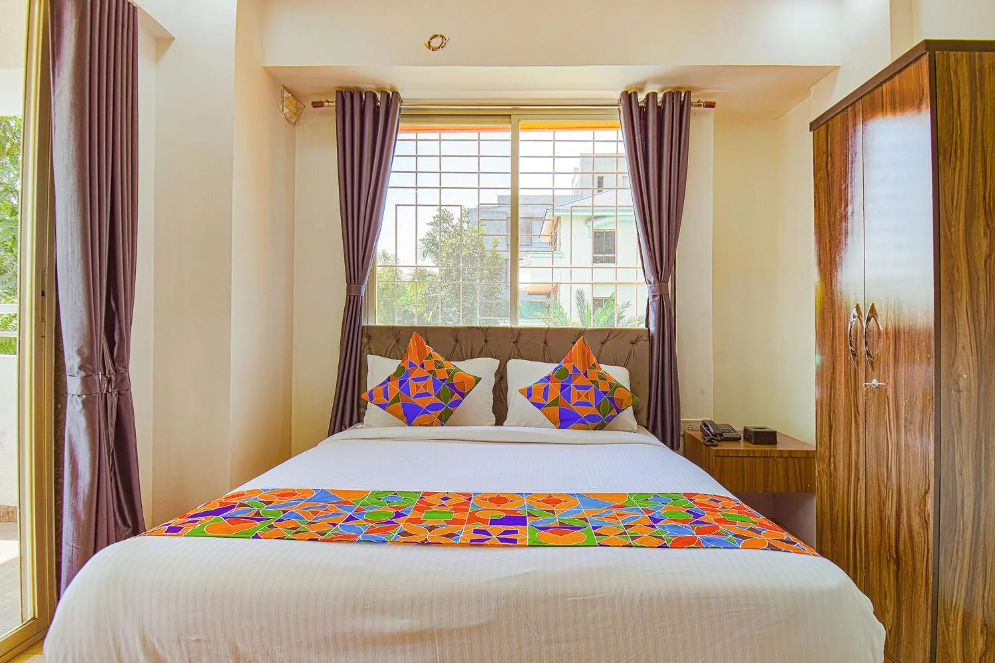 Bed in FabHotel Red Velvet Inn & Suites