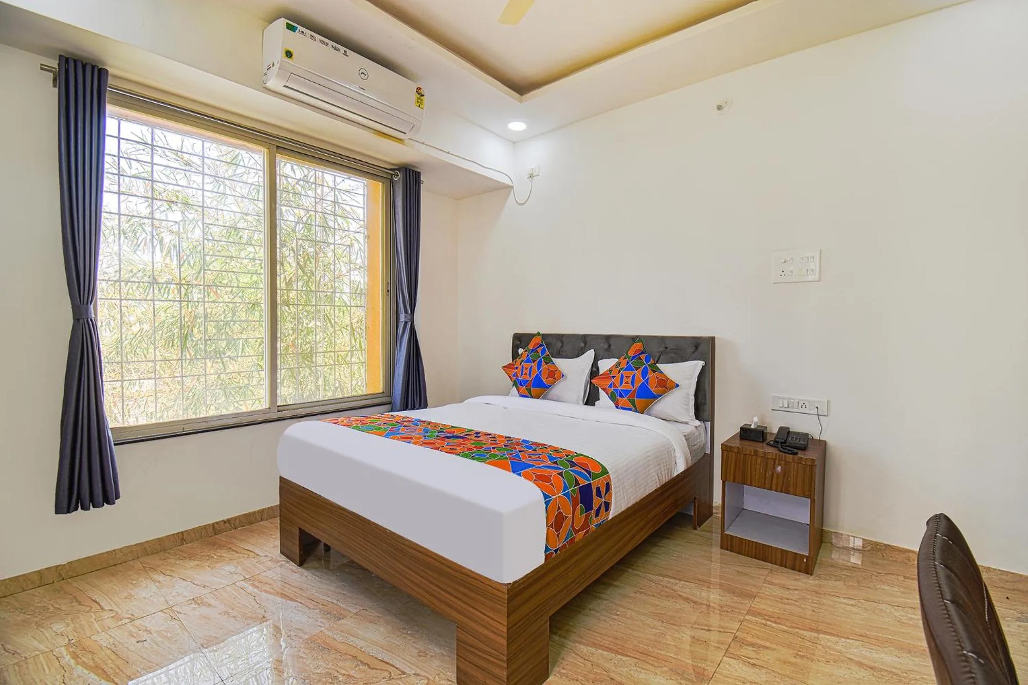 Bed in FabHotel Red Velvet Inn & Suites