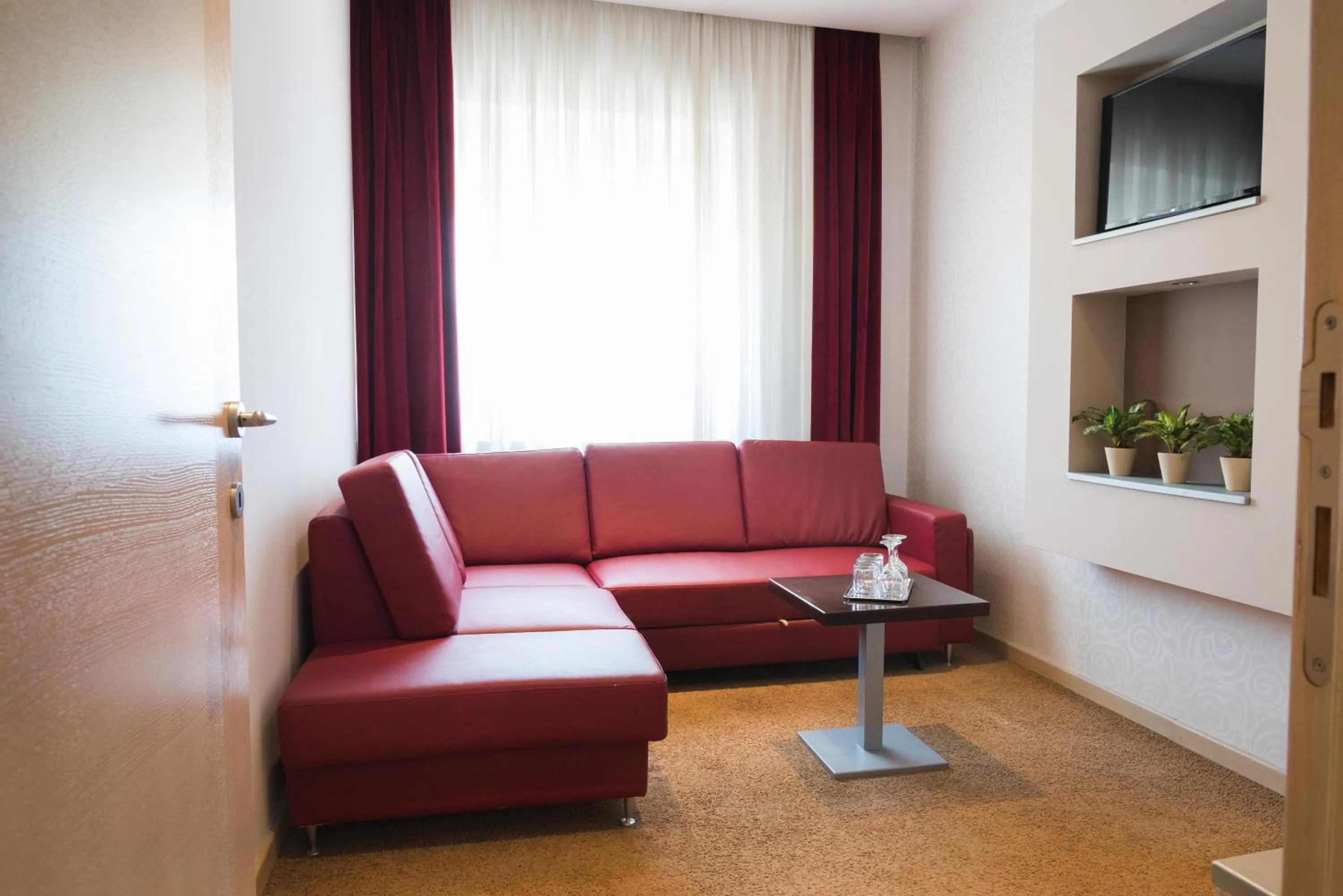 Living room in Garni Hotel Vigor - EV station