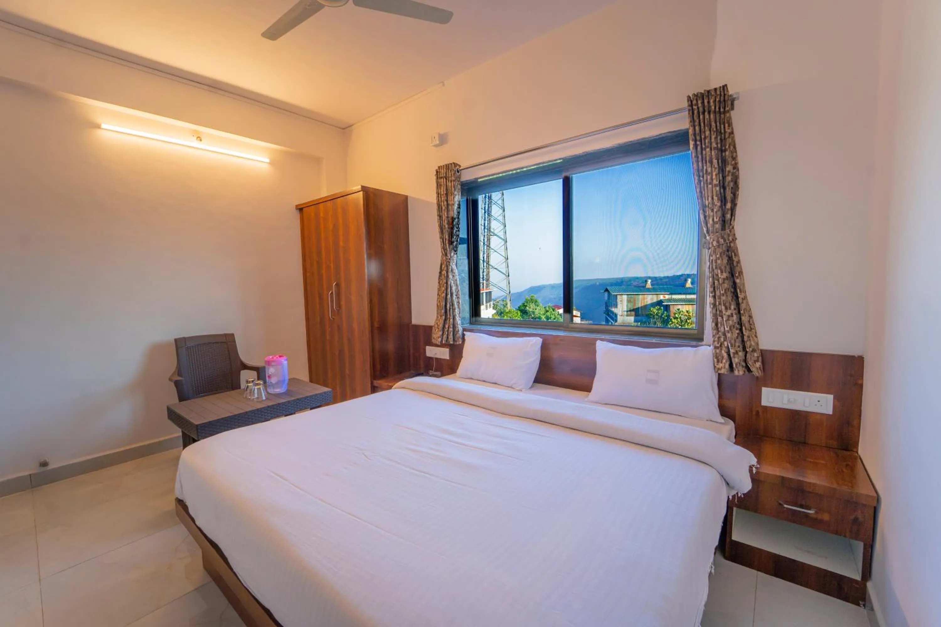 Photo of the whole room, Bed in Dhimahi Residency