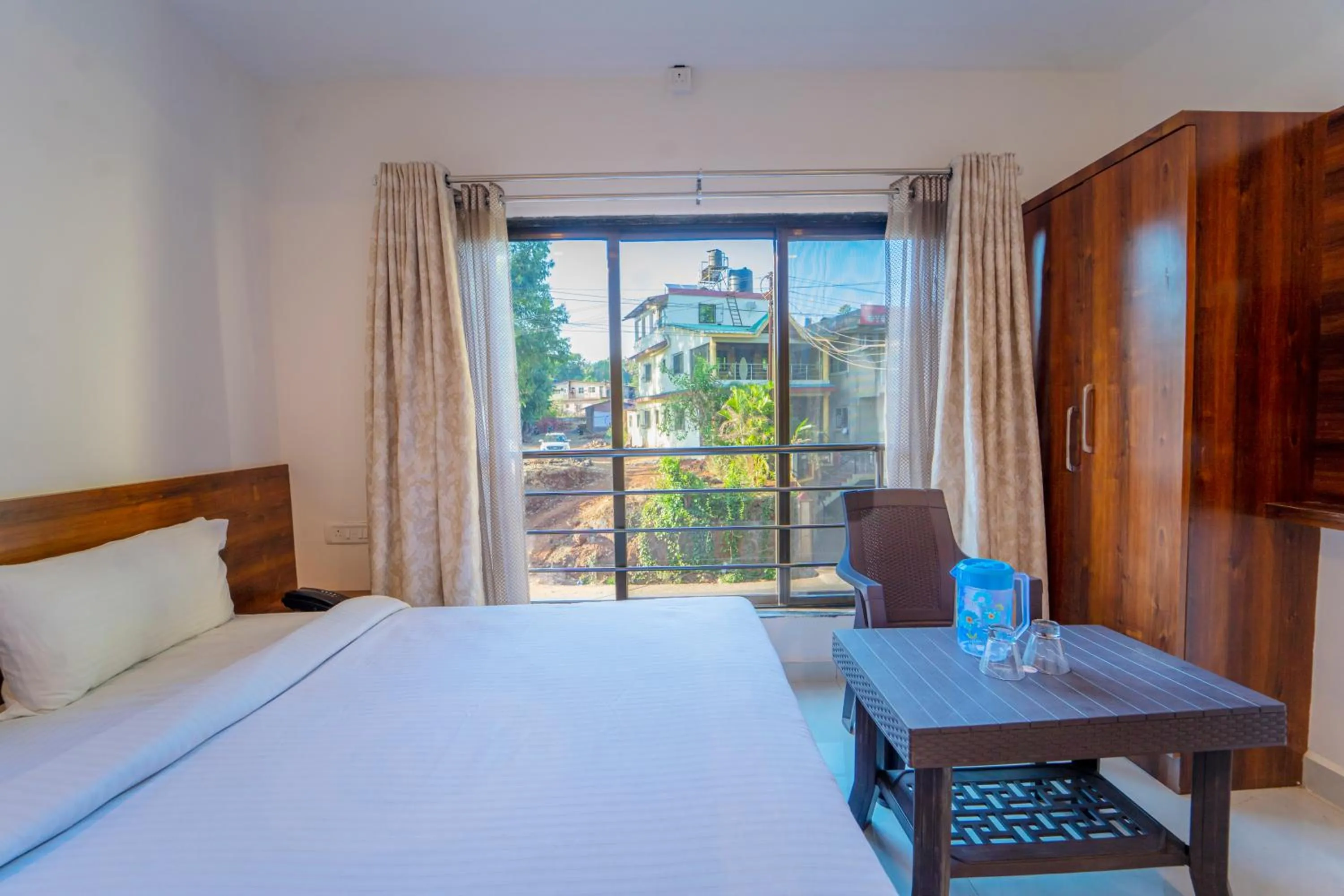 Photo of the whole room, Bed in Dhimahi Residency