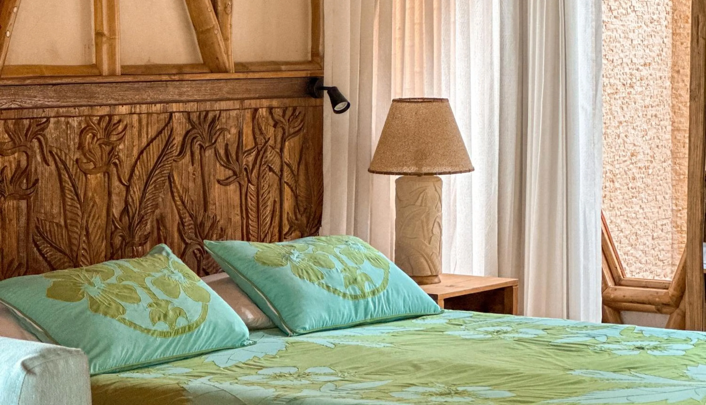 Bed in Magic Reef Bungalows
