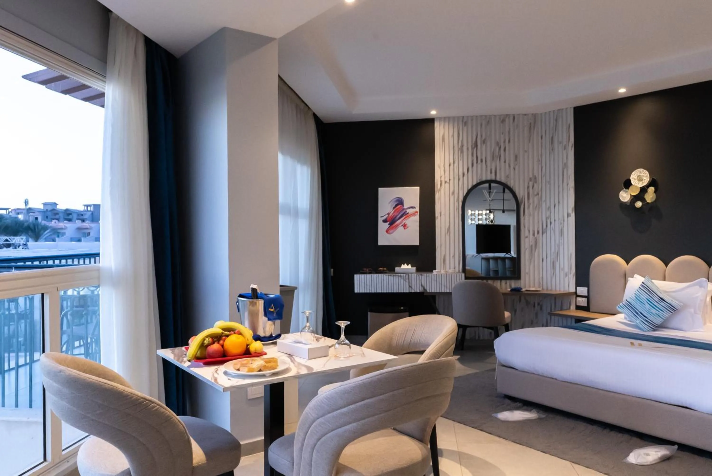 Seating area, Bed in THE V Luxury Resort Sahl Hasheesh