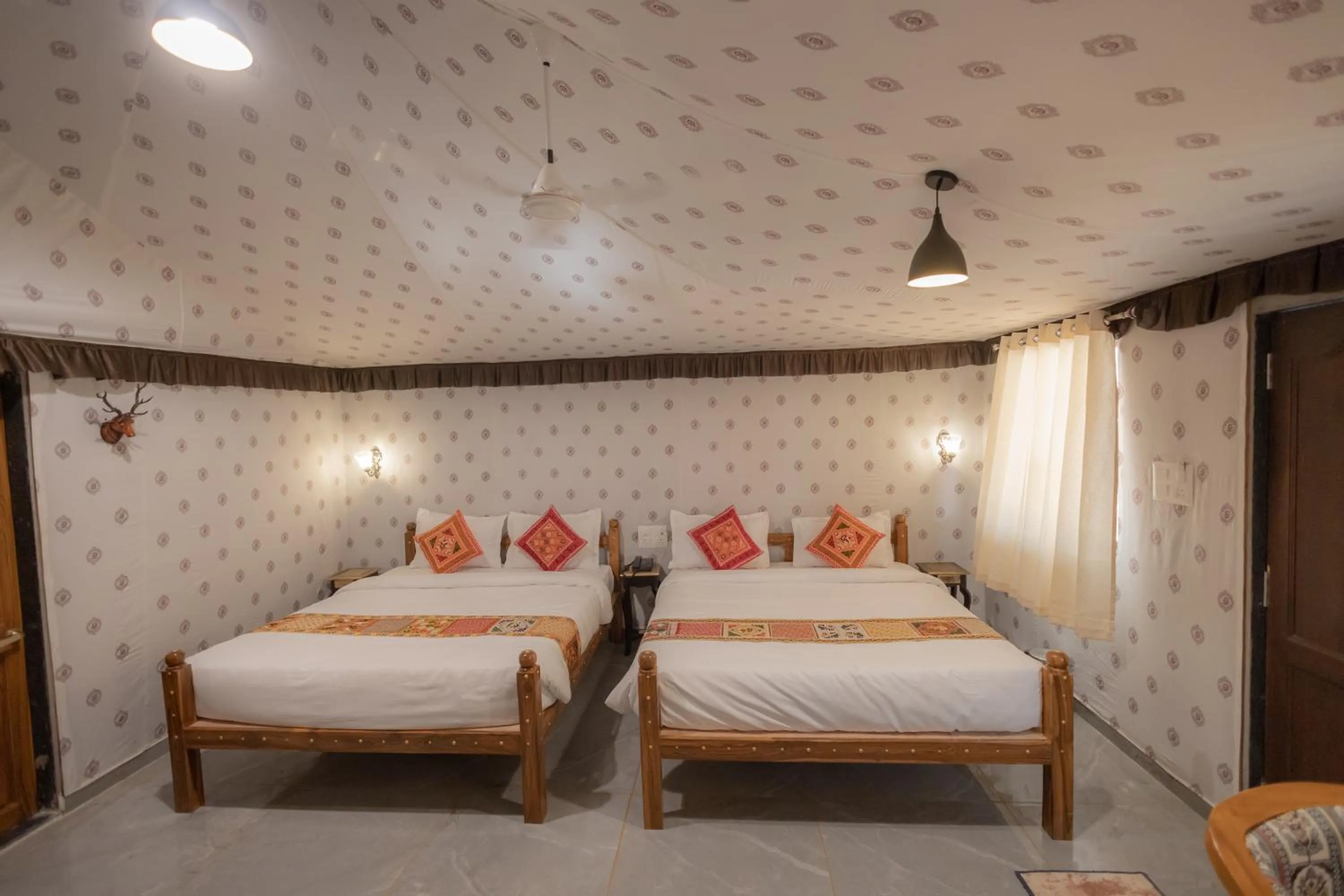 Bed in Vasant Vihar Resort