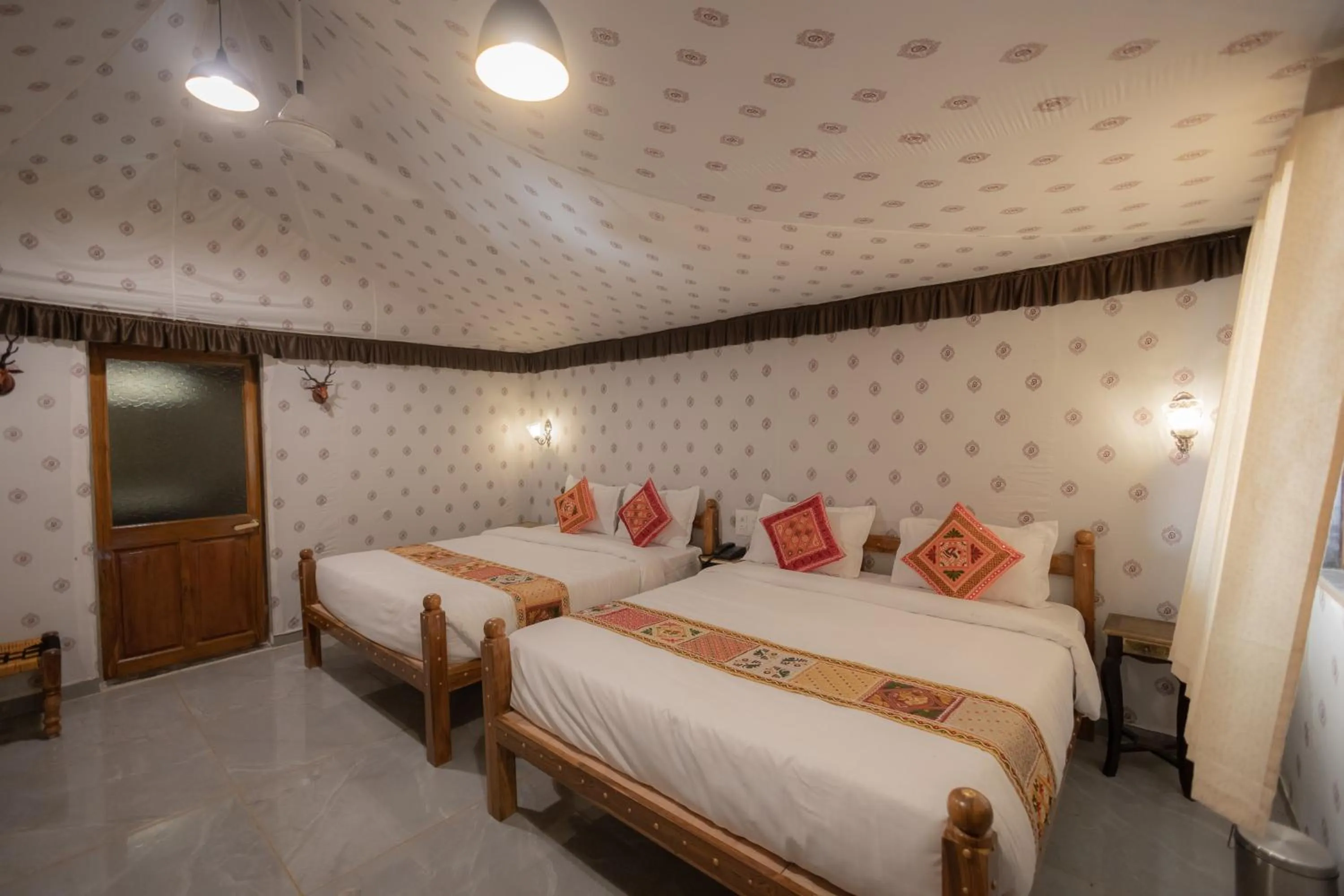 Bed in Vasant Vihar Resort