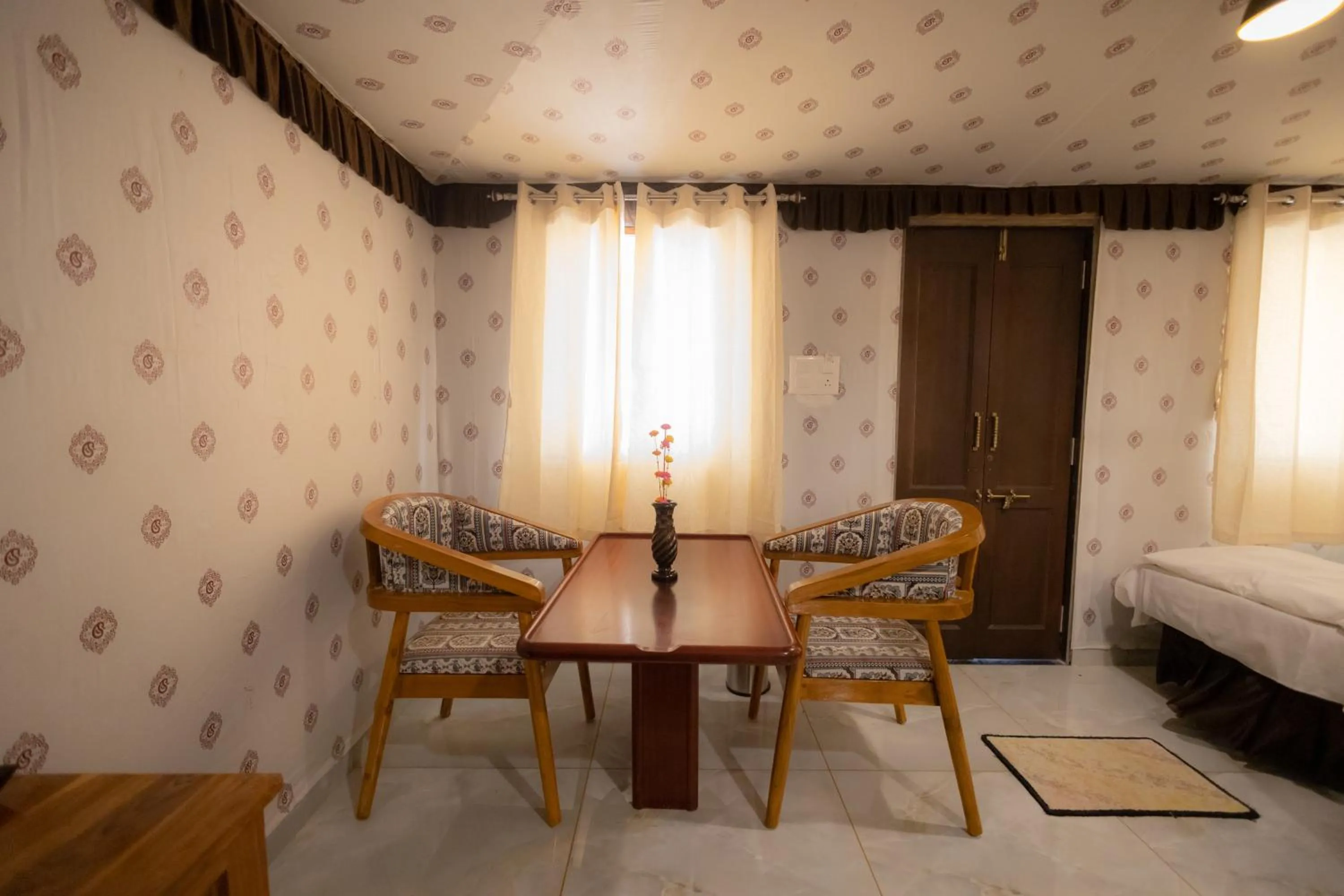 Seating area, Bed in Vasant Vihar Resort