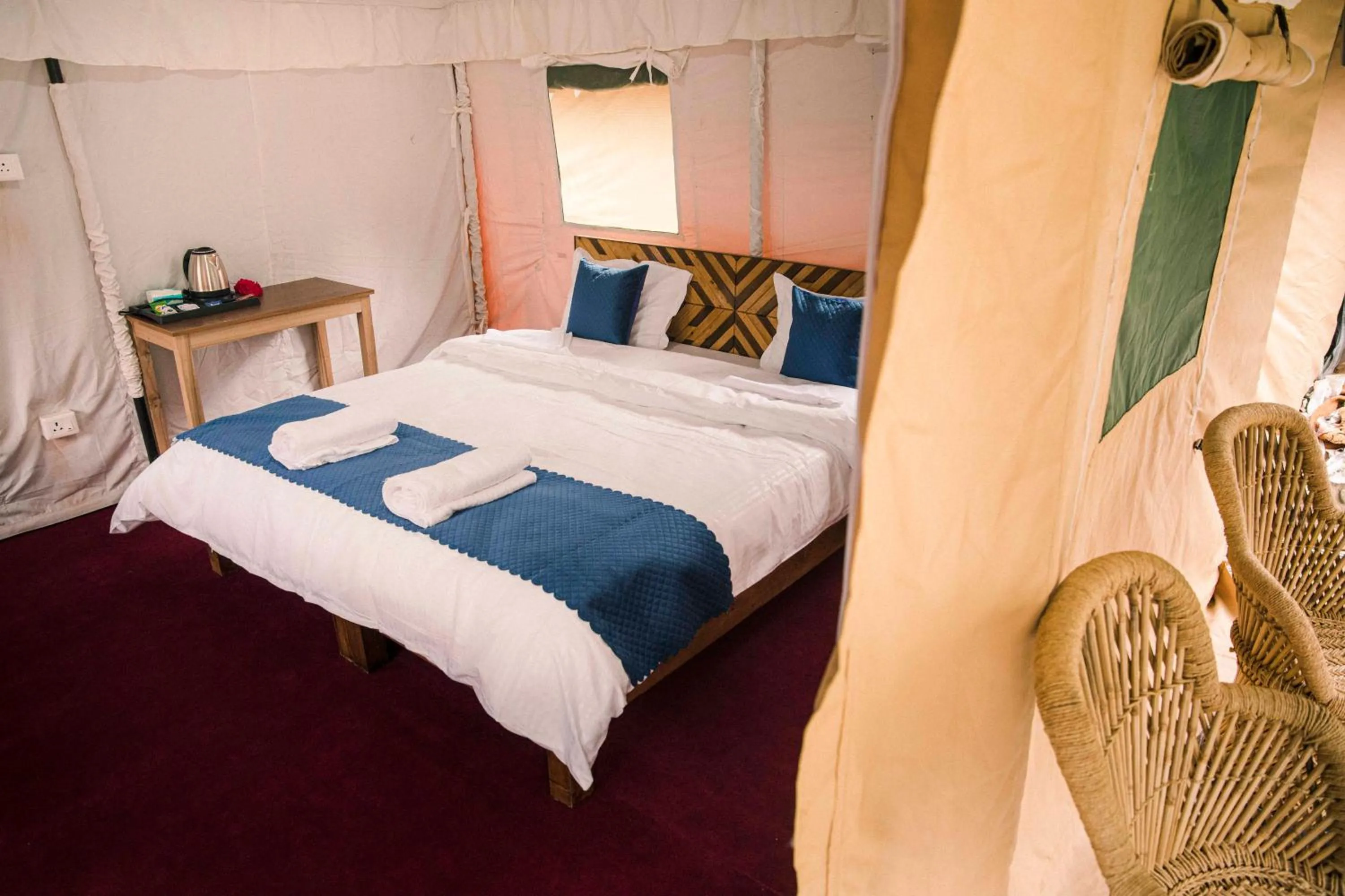 Bed in The Kamru Riverside Camps and Resorts