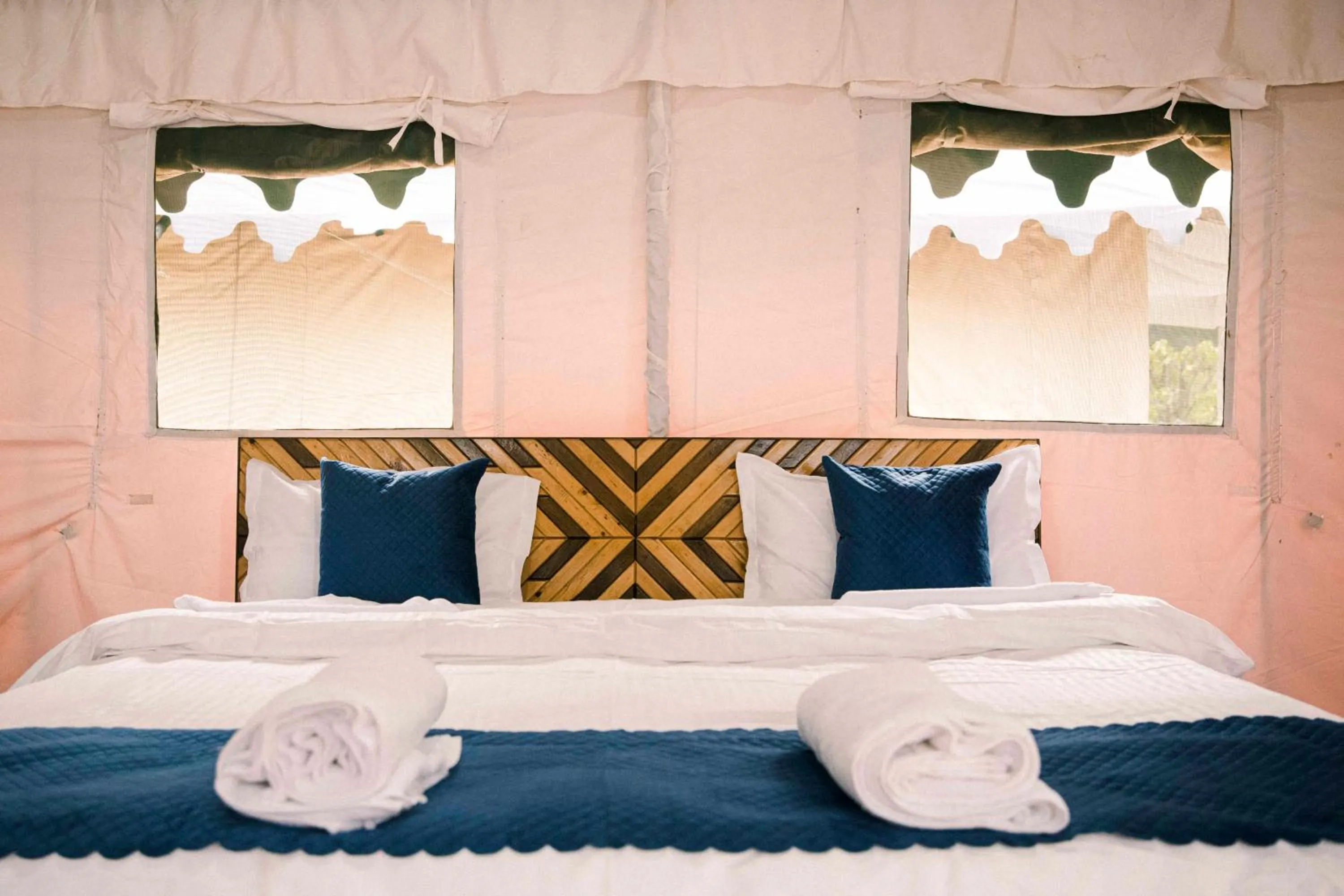 Bed in The Kamru Riverside Camps and Resorts