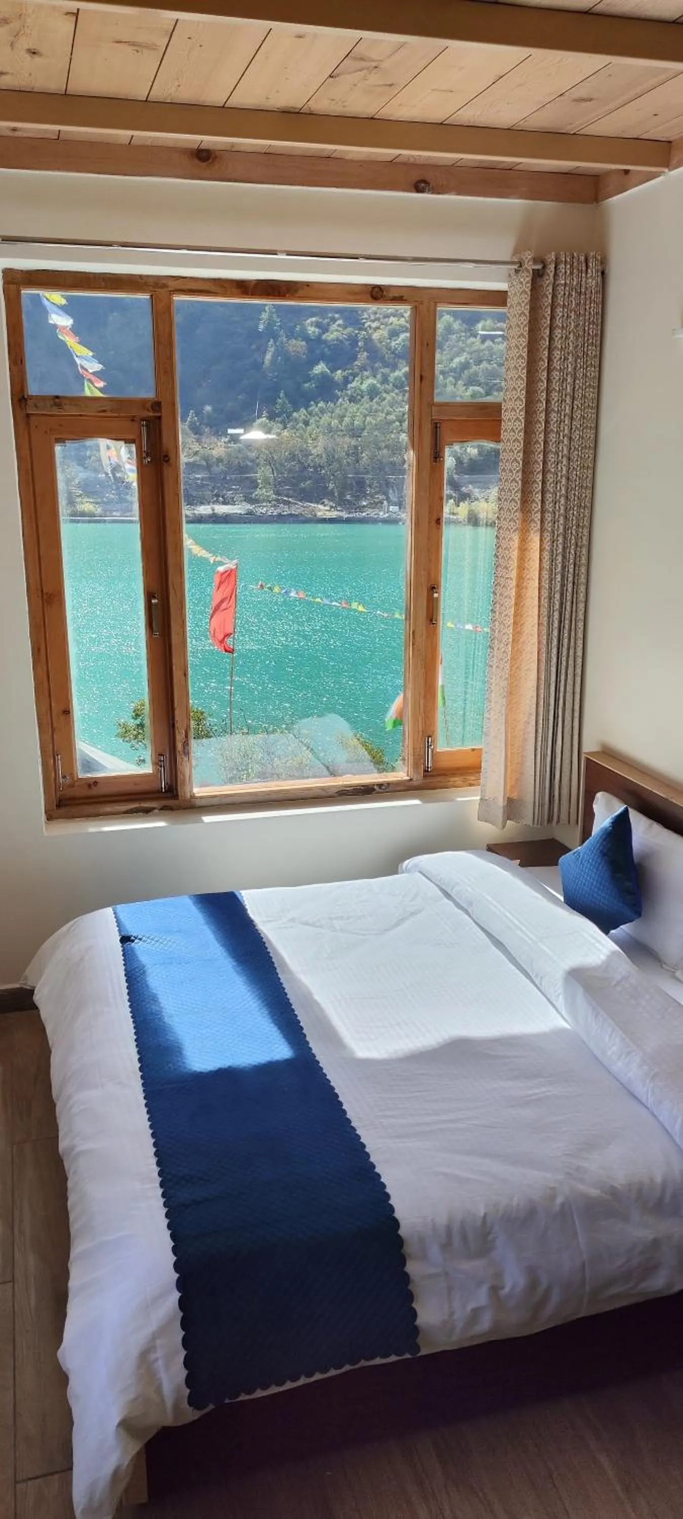 Photo of the whole room, Bed in The Kamru Riverside Camps and Resorts