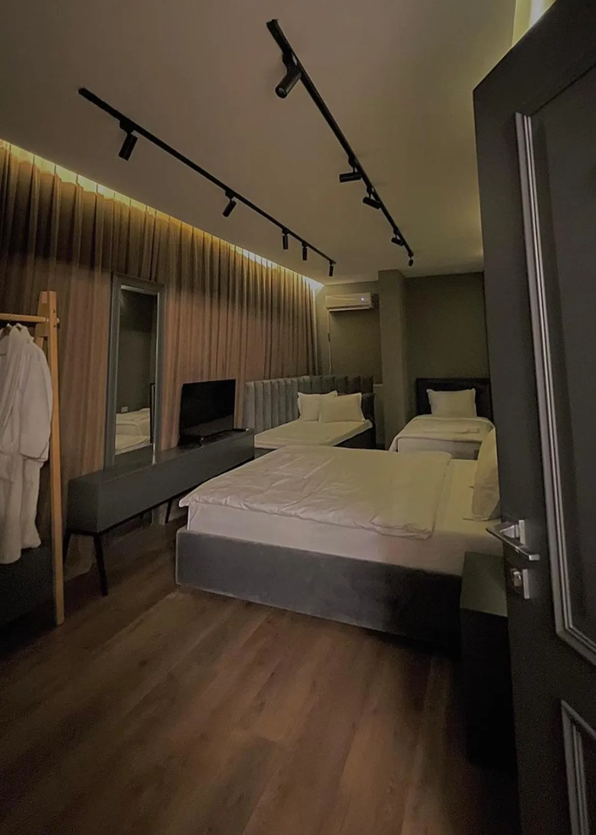 Bed in GRAND JNK Boutique Hotel