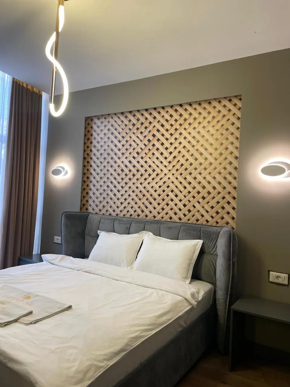 Bed in GRAND JNK Boutique Hotel