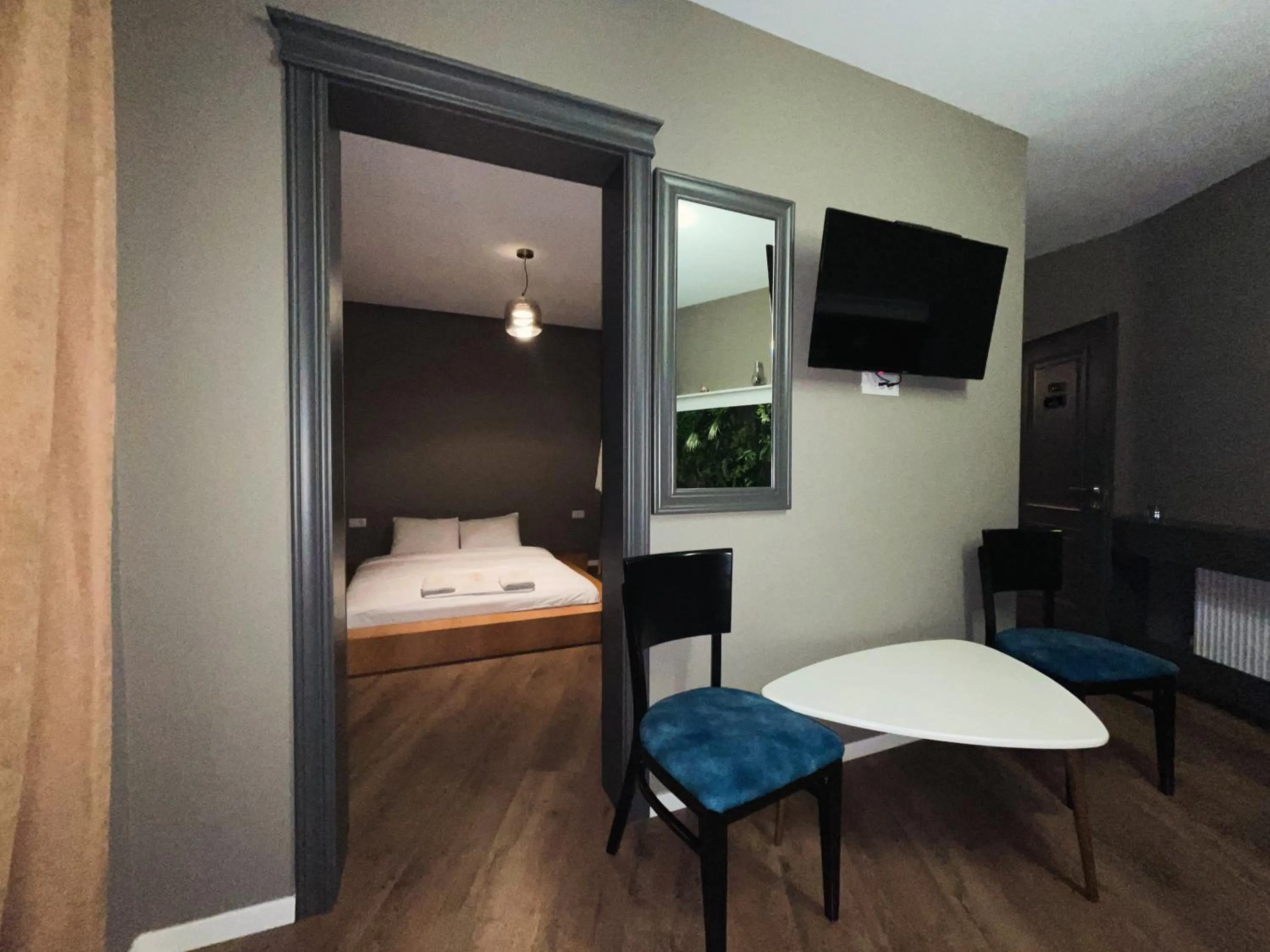 Bed in GRAND JNK Boutique Hotel