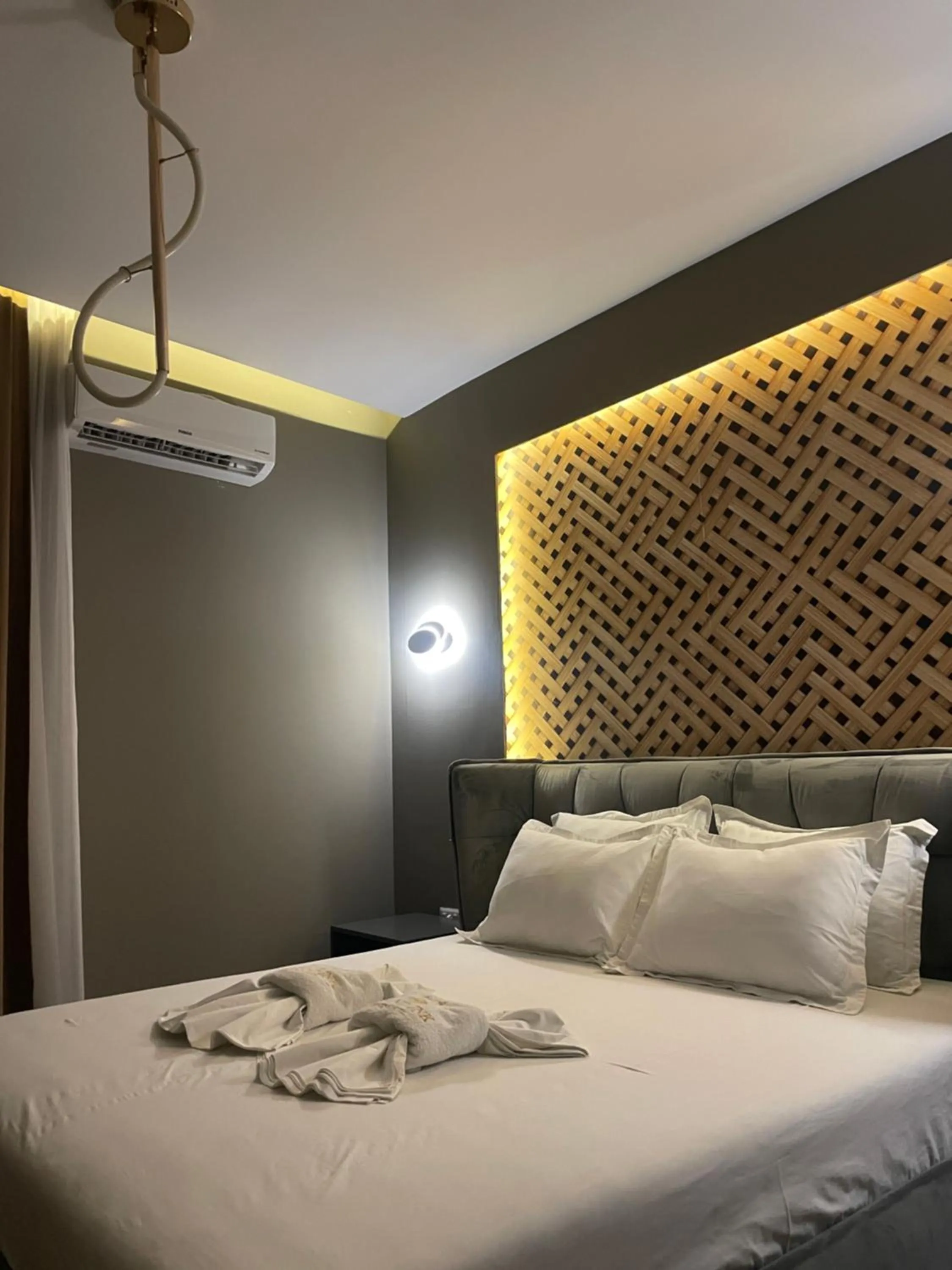 Bed in GRAND JNK Boutique Hotel