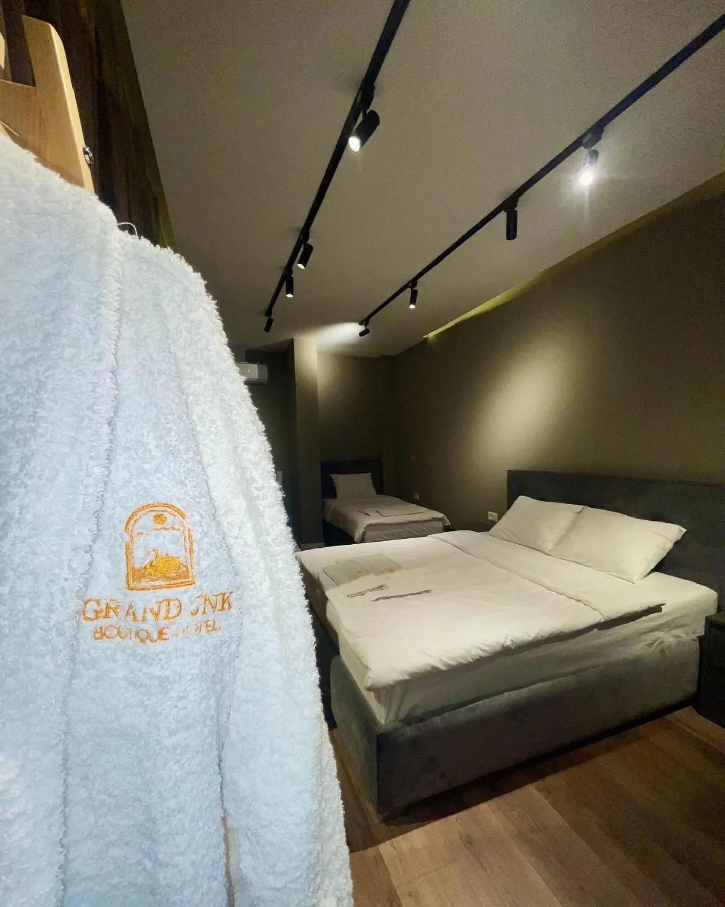 Bed in GRAND JNK Boutique Hotel
