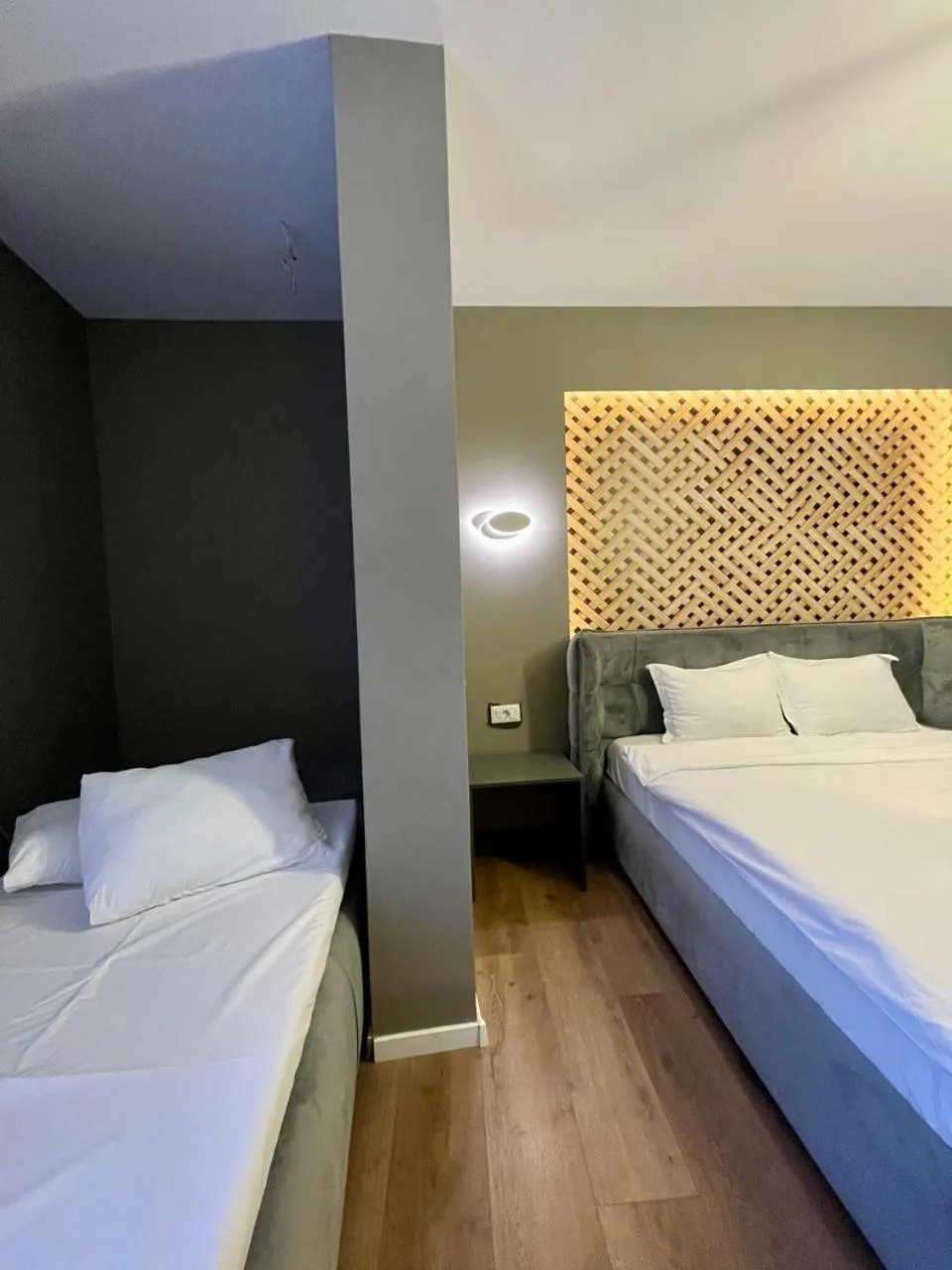 Bed in GRAND JNK Boutique Hotel