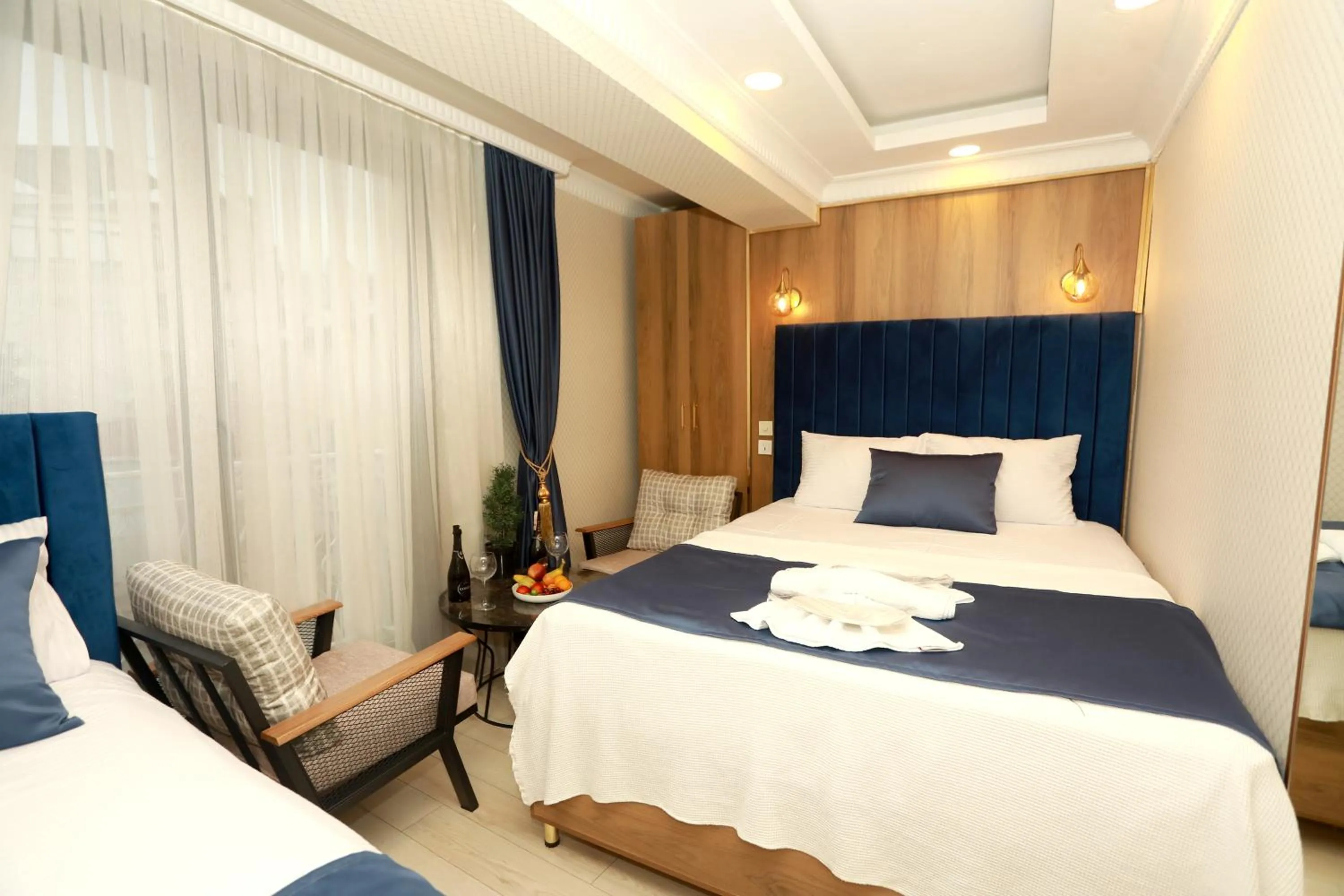 Bed in IMMORTELLE HOTEL