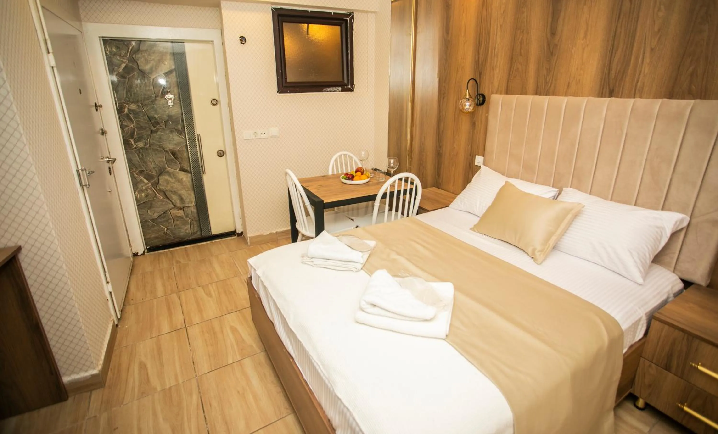 Bed in IMMORTELLE HOTEL