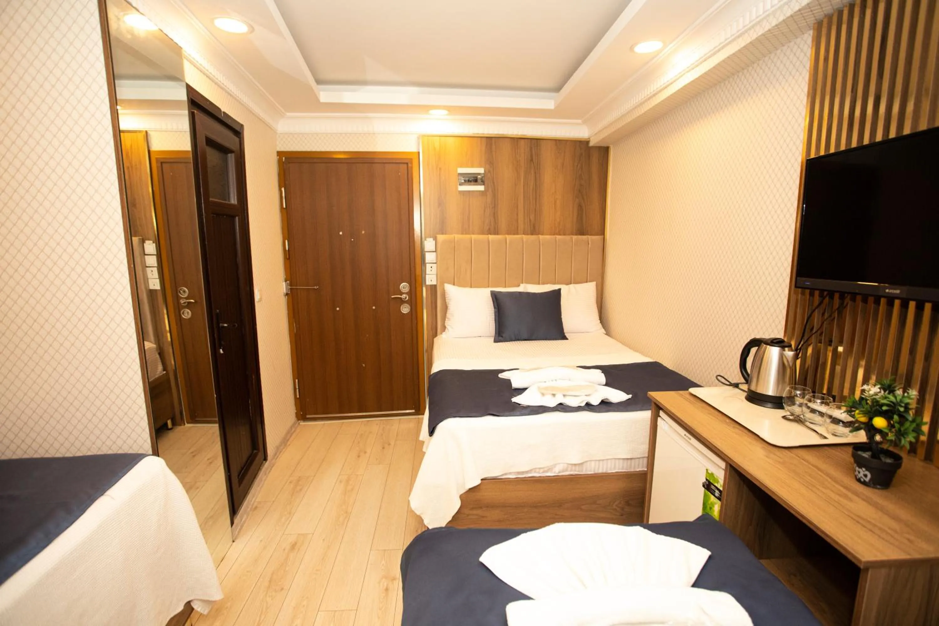 Bed in IMMORTELLE HOTEL