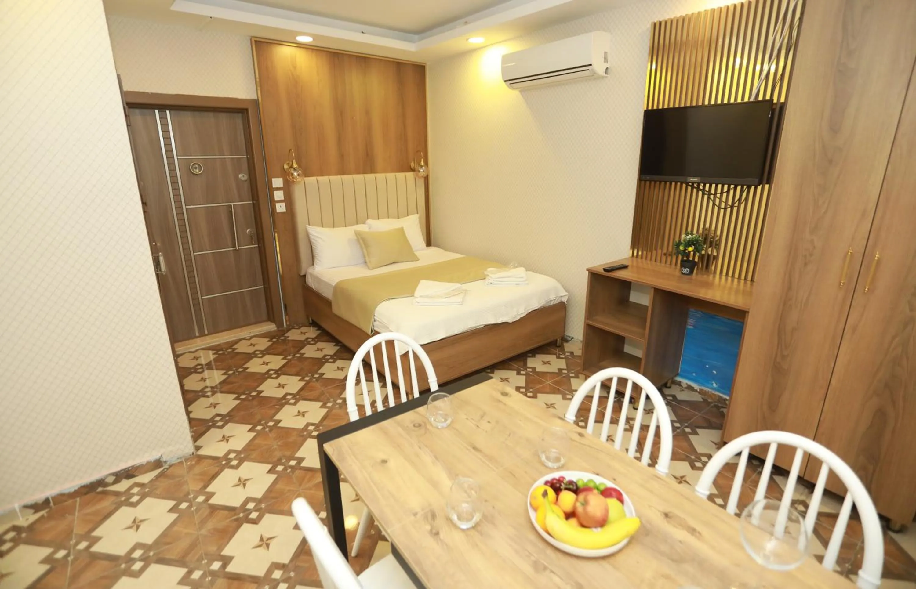 Bed in IMMORTELLE HOTEL