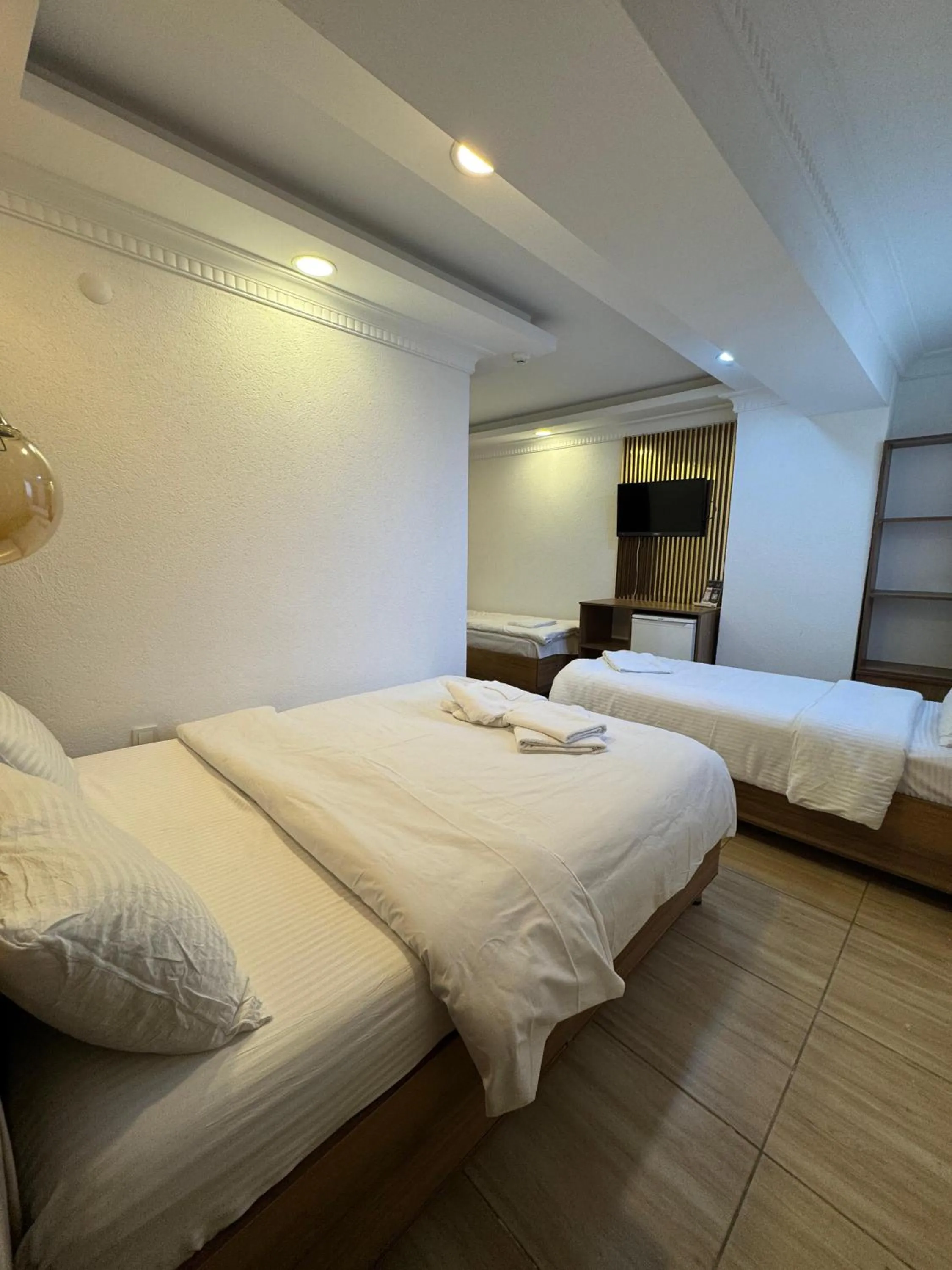 Bed in IMMORTELLE HOTEL