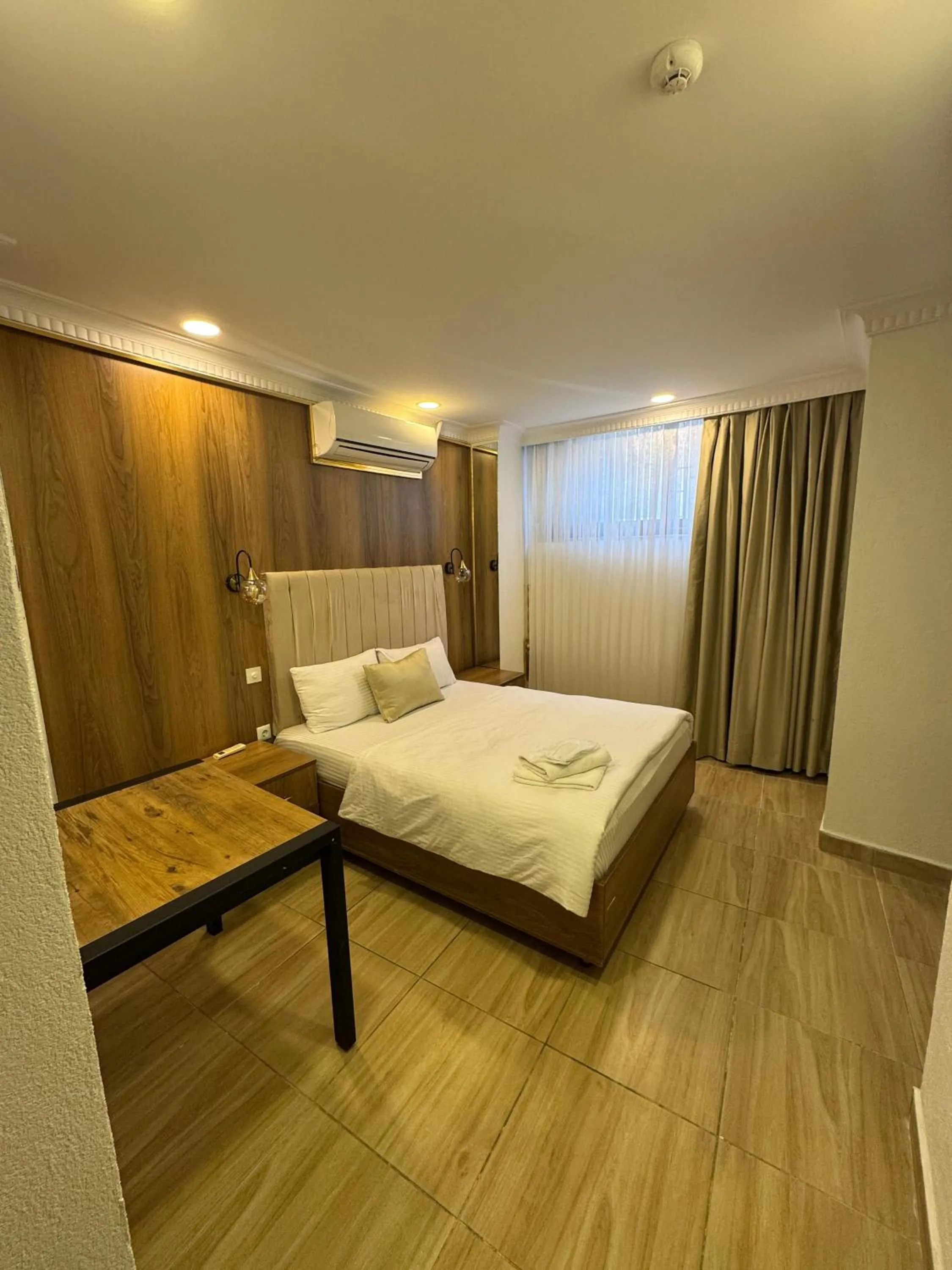 Bed in IMMORTELLE HOTEL