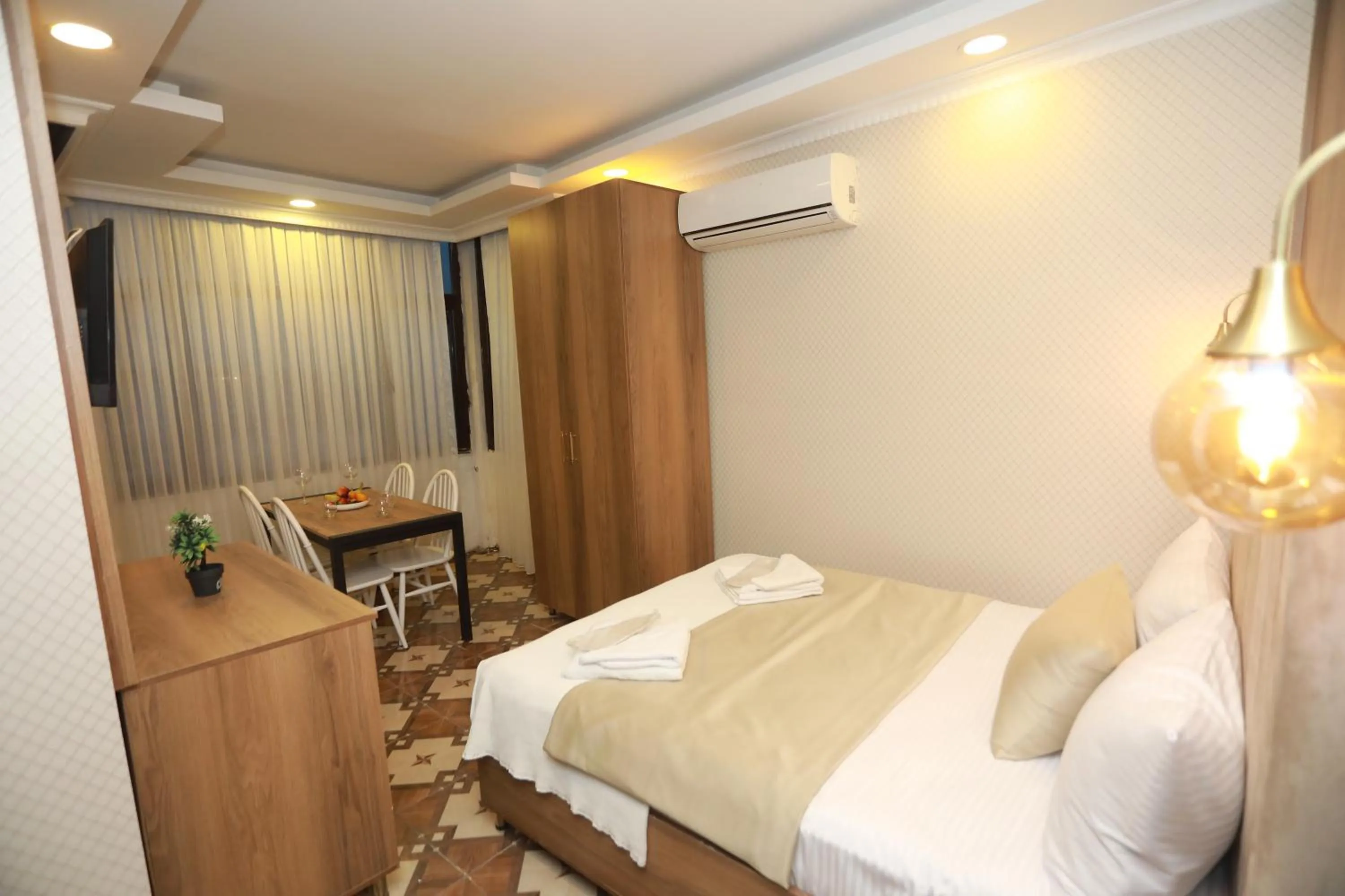 Bed in IMMORTELLE HOTEL