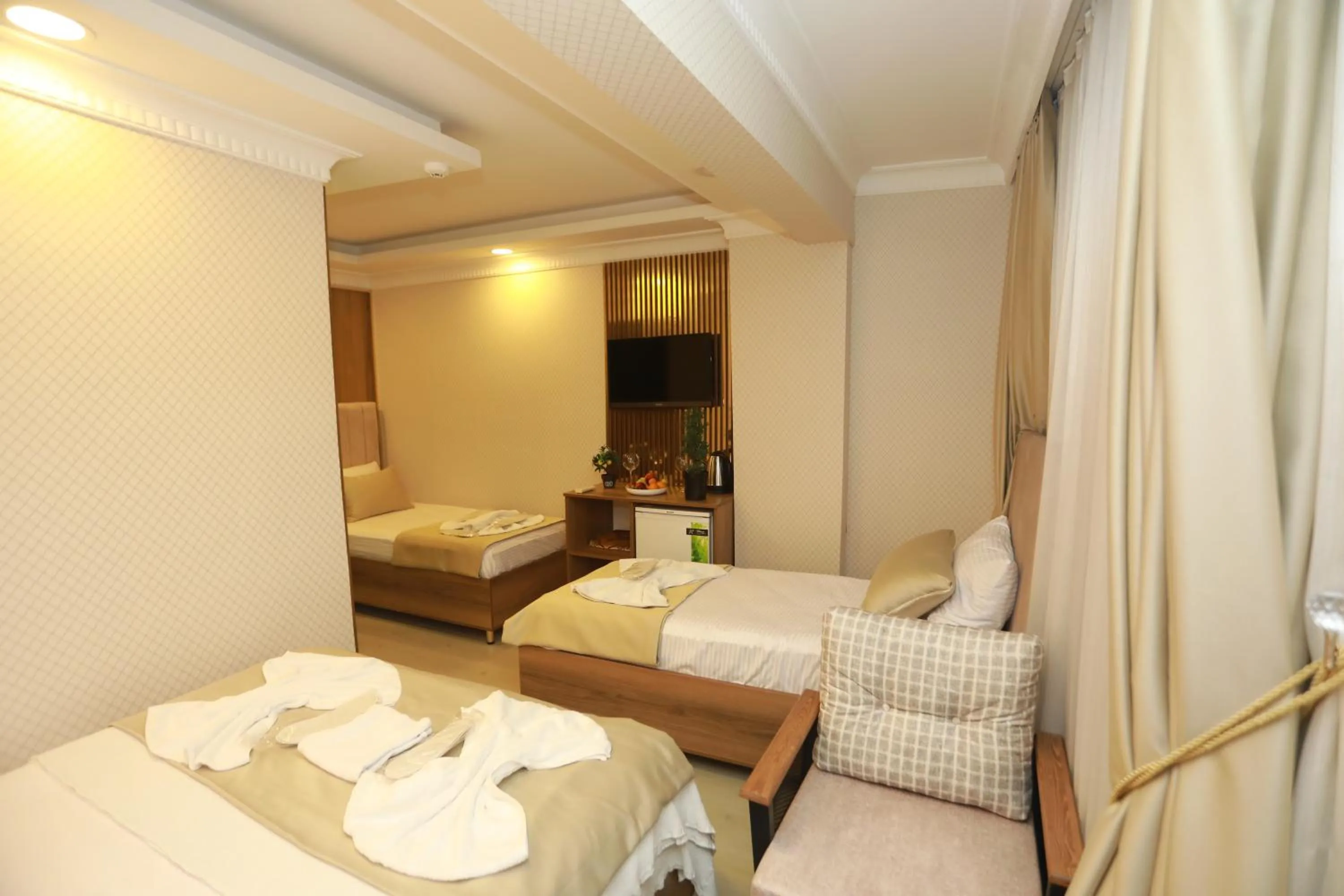 Bed in IMMORTELLE HOTEL