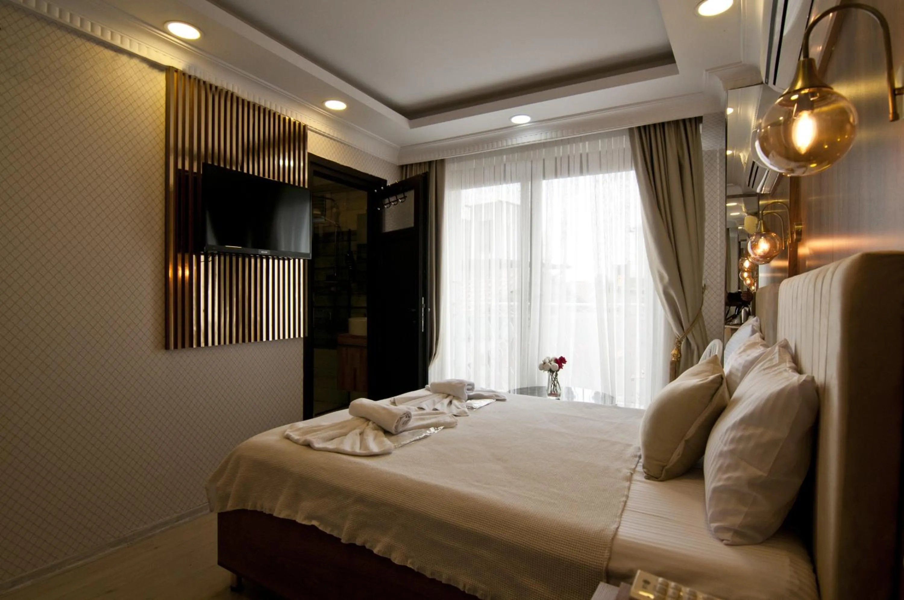 Bed in IMMORTELLE HOTEL