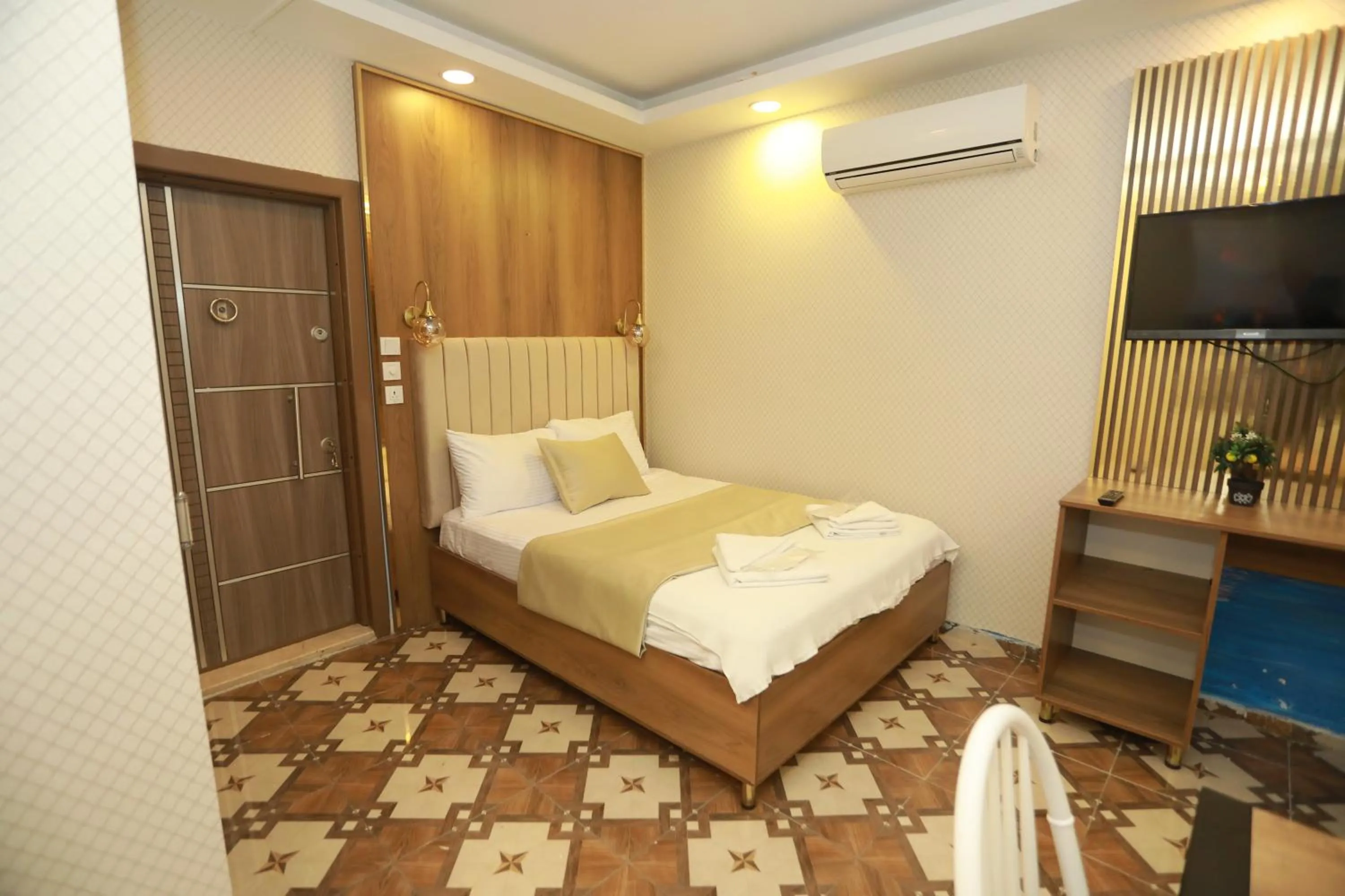 Bed in IMMORTELLE HOTEL