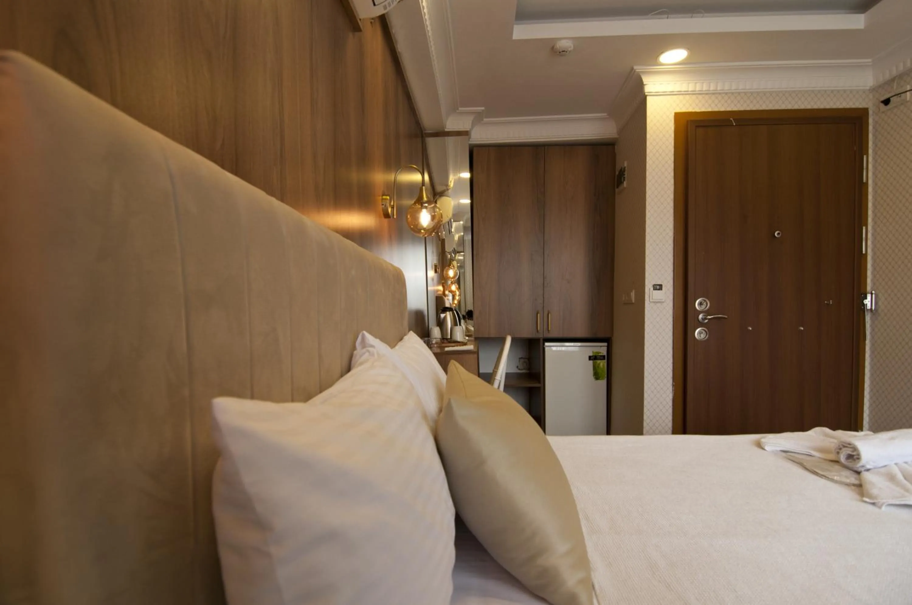 Bed in IMMORTELLE HOTEL