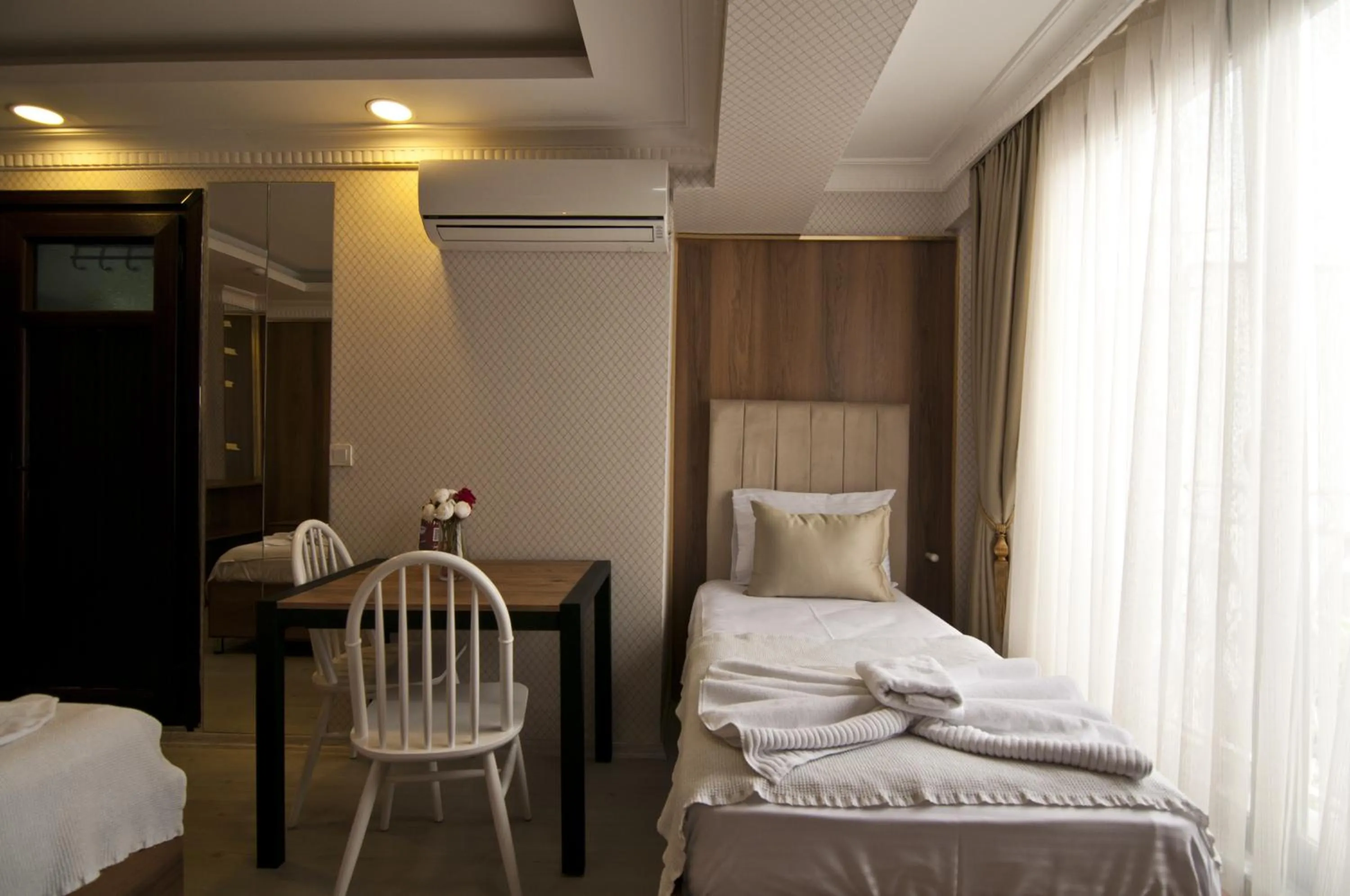 Bed in IMMORTELLE HOTEL