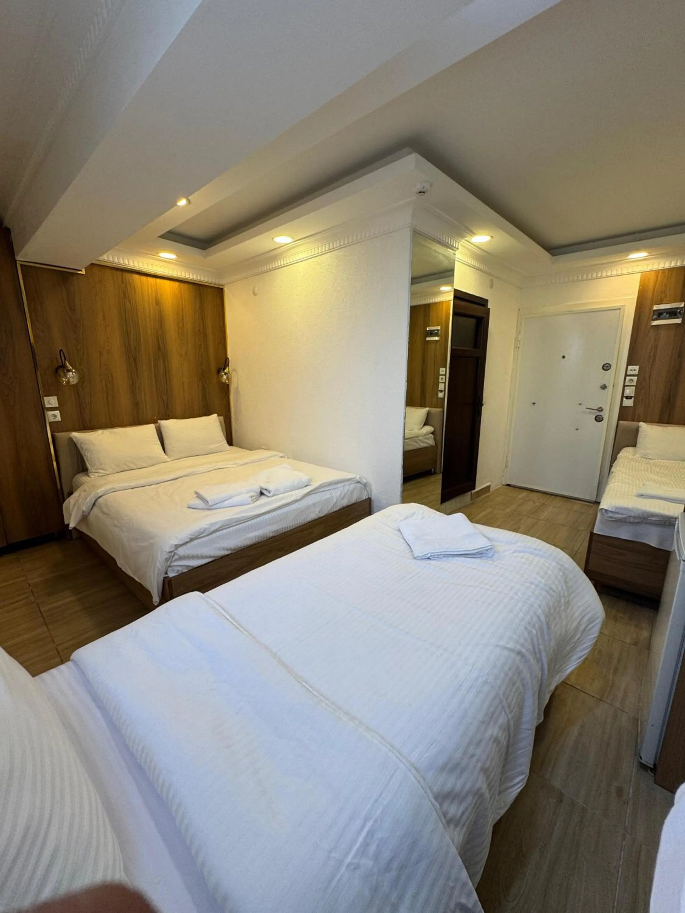 Bed in IMMORTELLE HOTEL