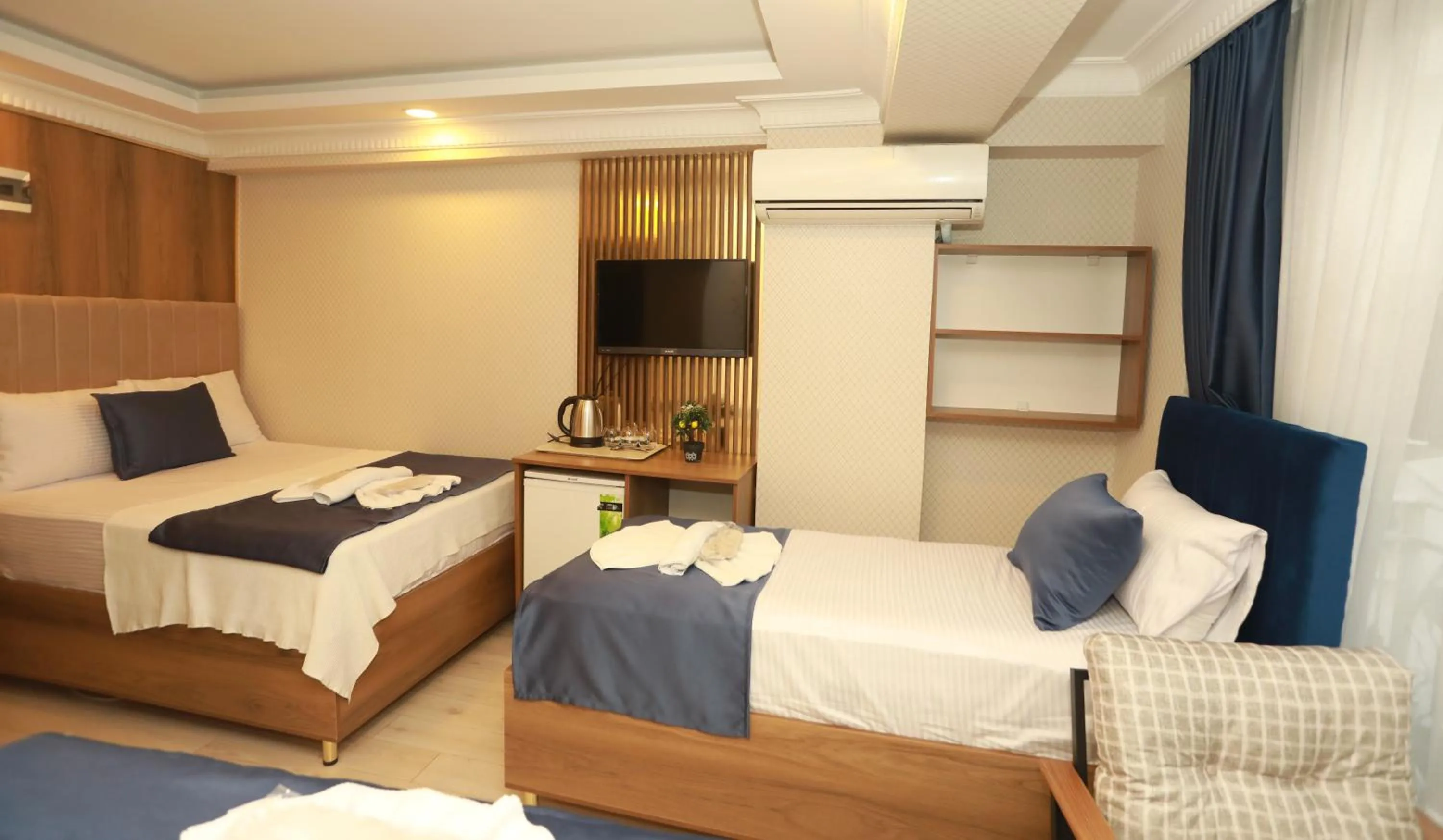 Bed in IMMORTELLE HOTEL