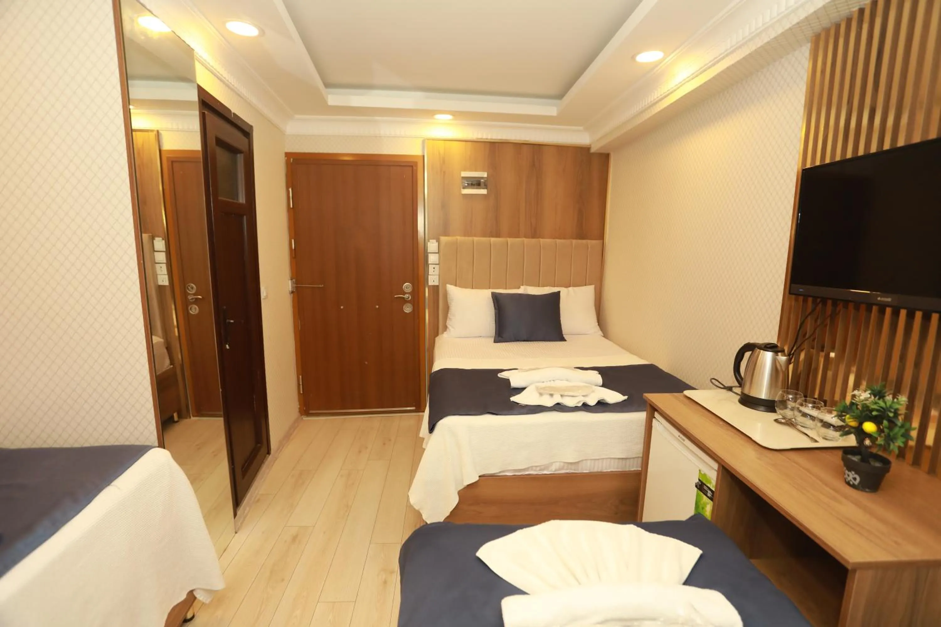 Bed in IMMORTELLE HOTEL