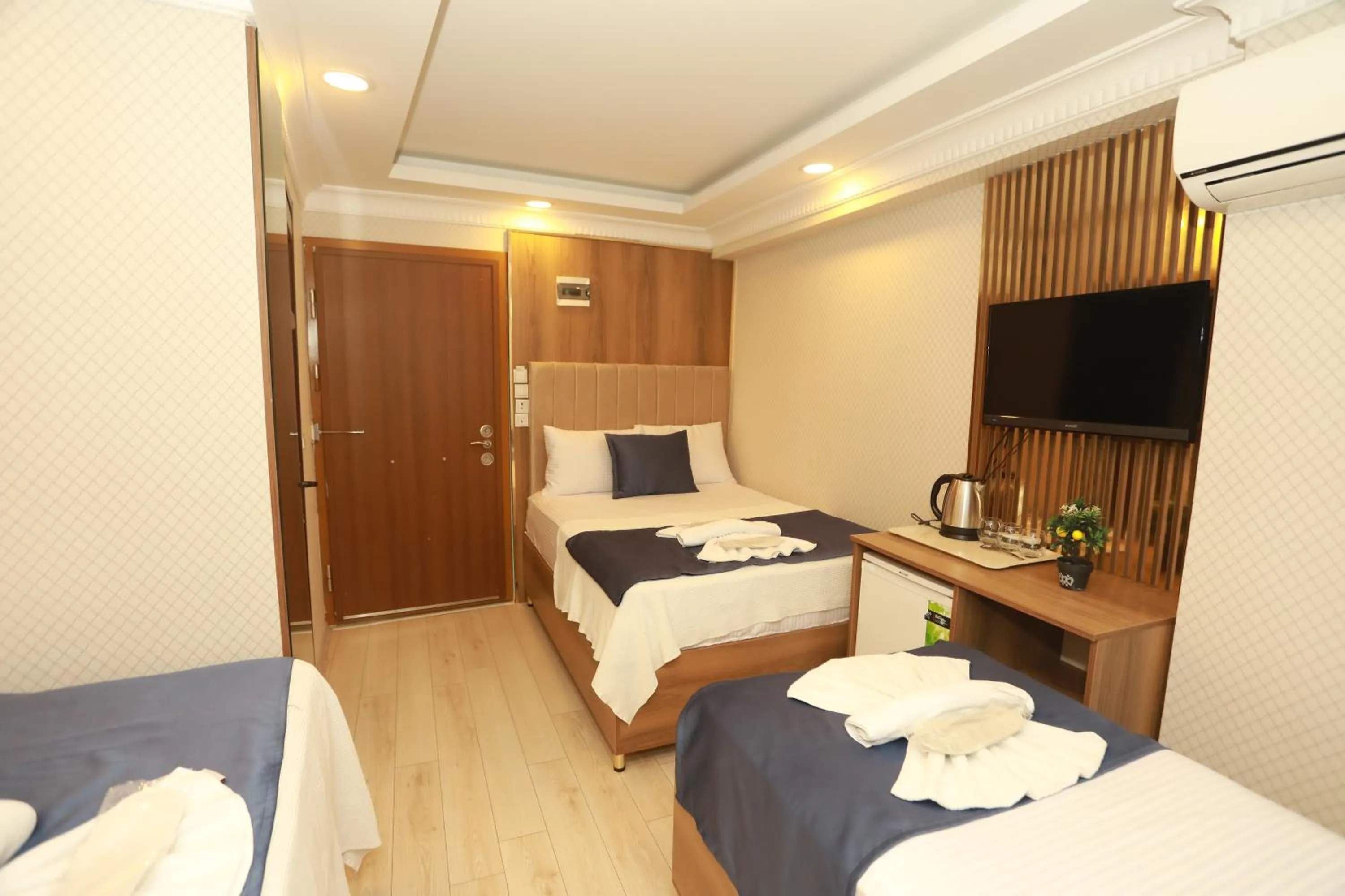 Bed in IMMORTELLE HOTEL