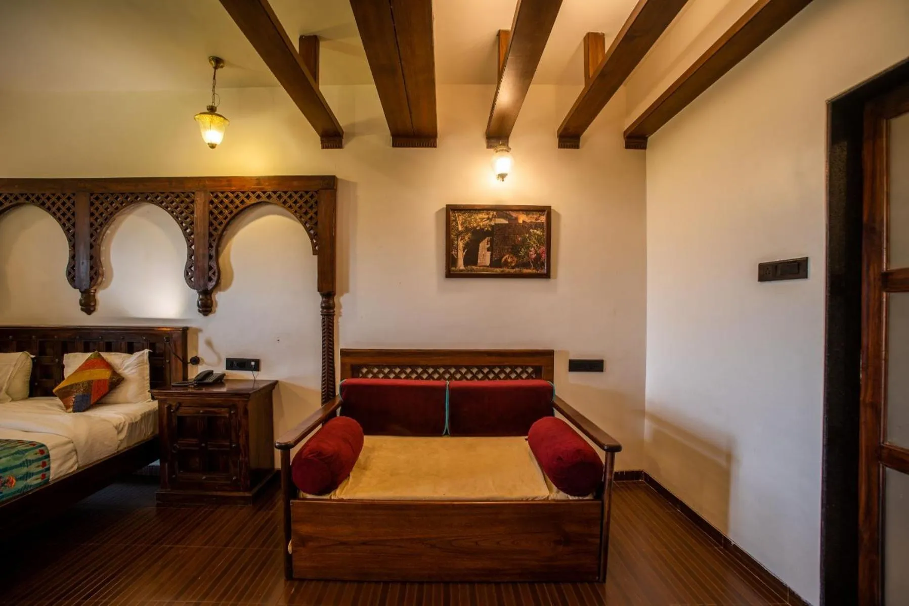 Seating area, Bed in Malhar Machi Mountain Resorts