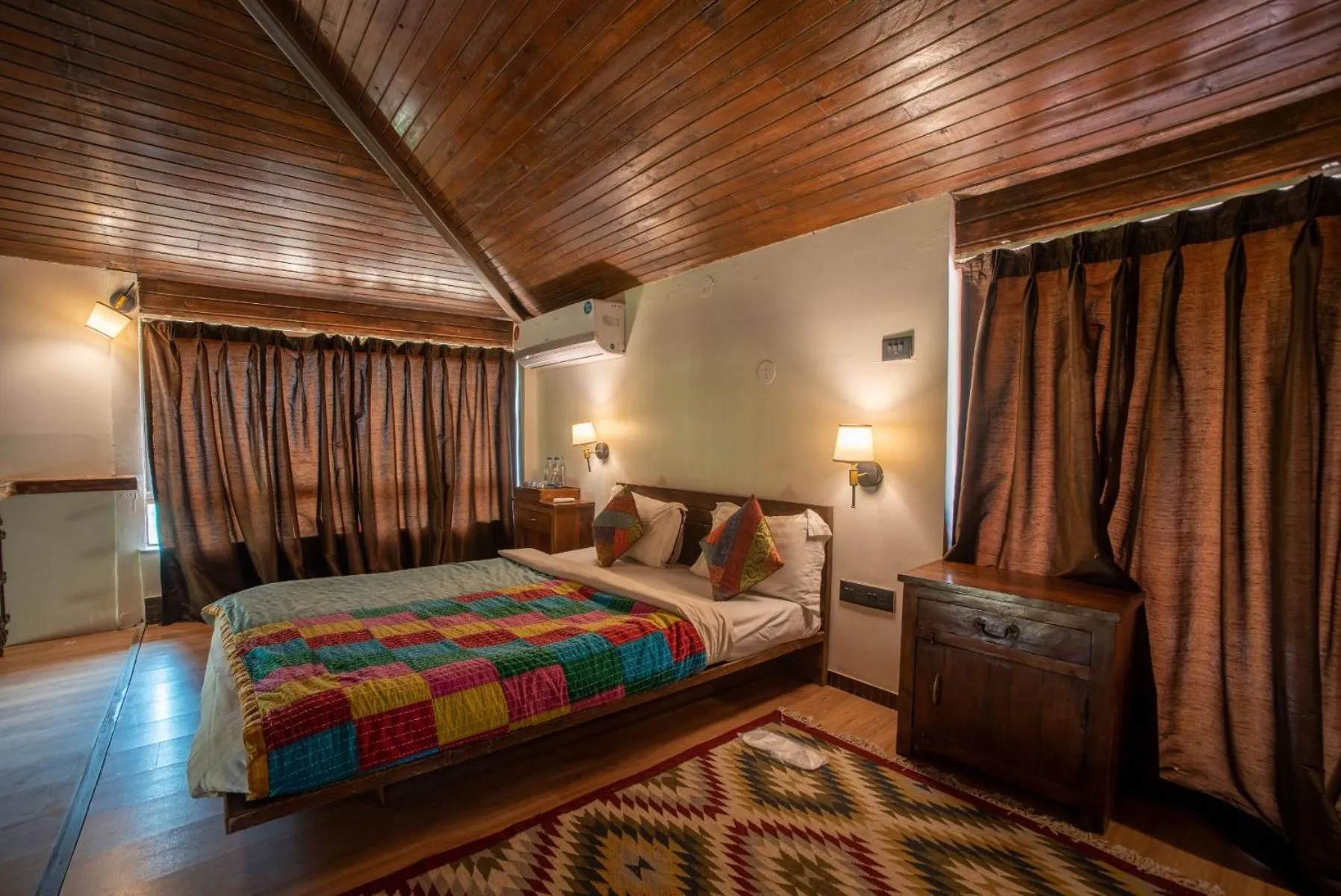 Bed in Malhar Machi Mountain Resorts