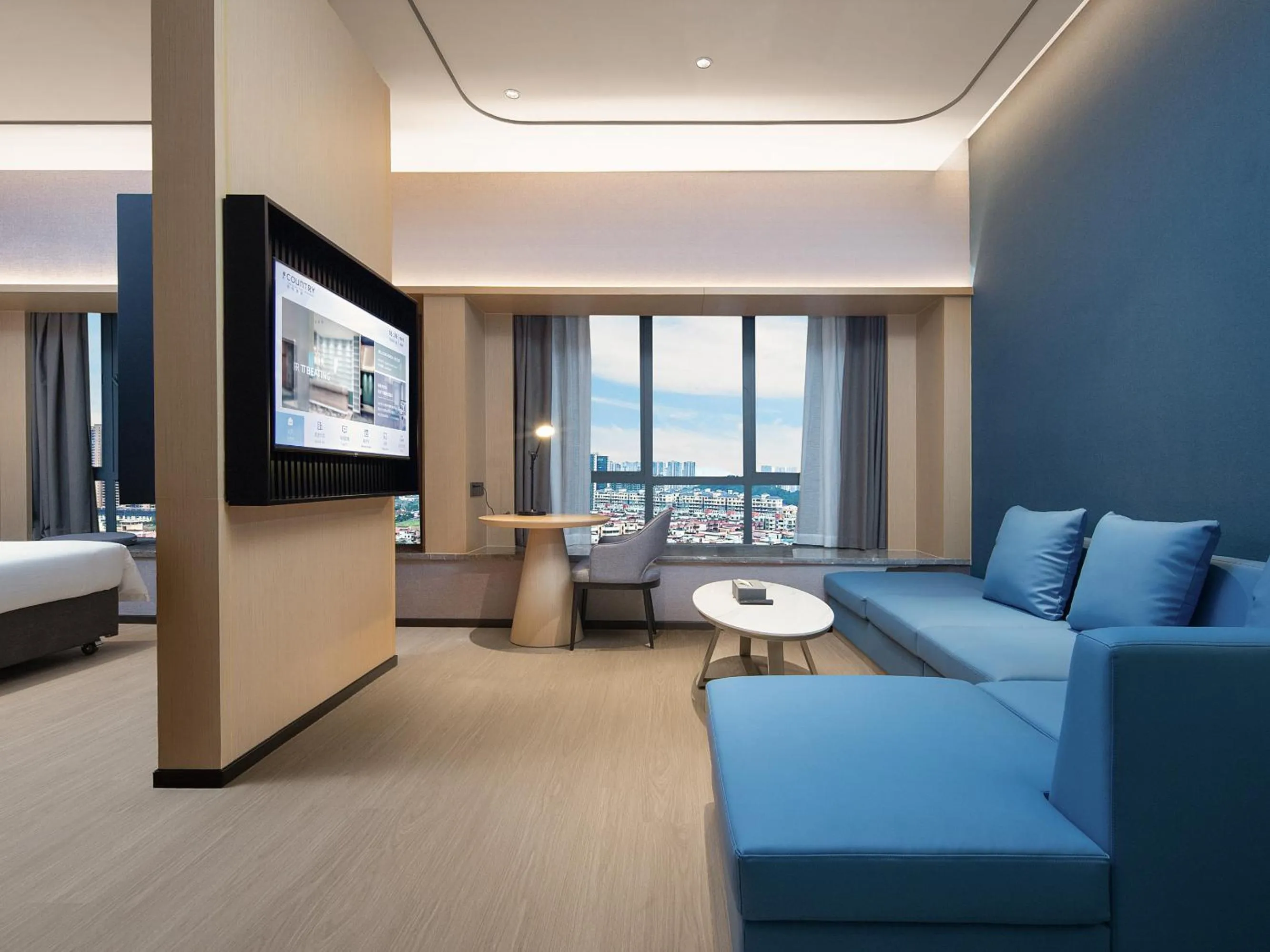 Communal lounge/ TV room in Country Inn & Suites by Radisson - Taishan East Branch