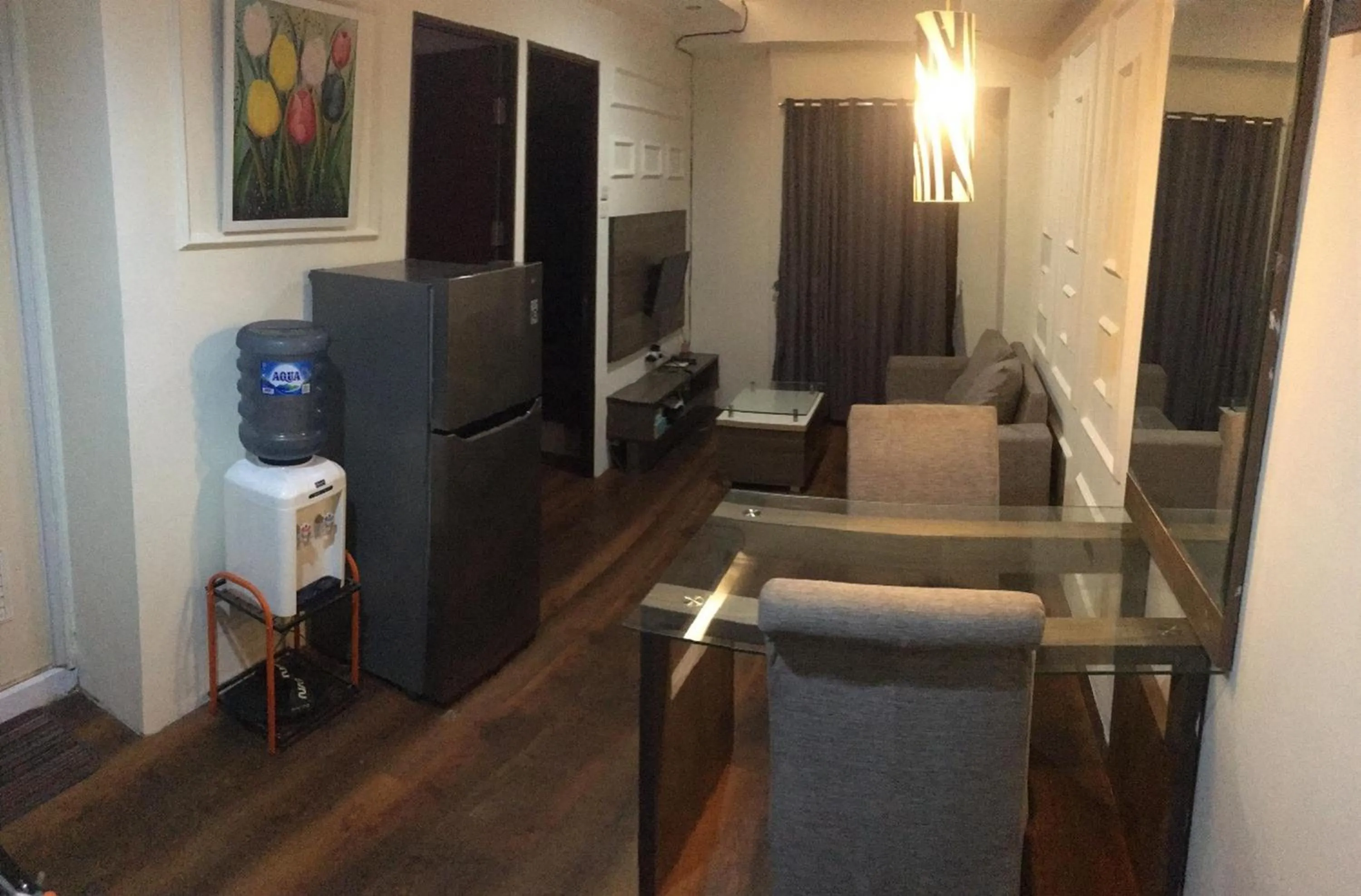 Living room in RedLiving Apartemen Tamansari Panoramic - Anwar Rental