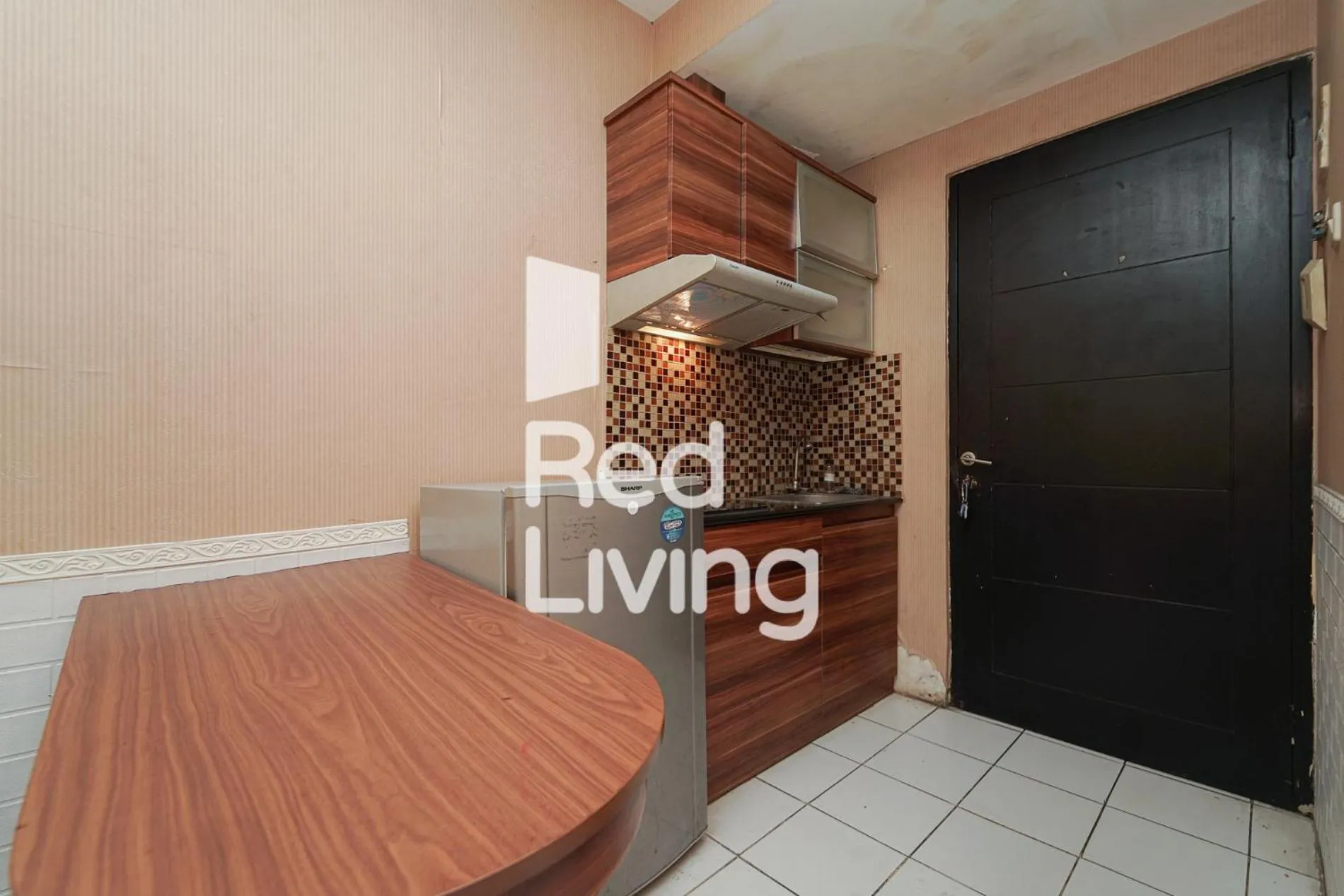Kitchen or kitchenette in RedLiving Apartemen Paragon Village Karawaci - Ujang Rooms