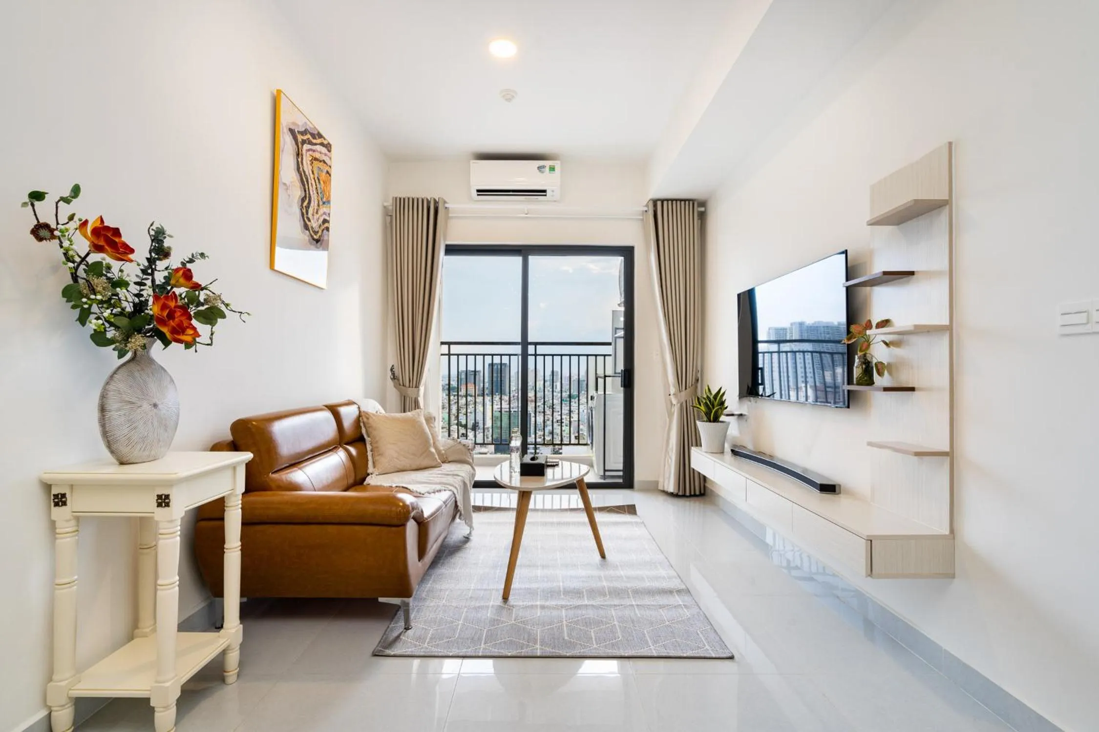 Communal lounge/ TV room in Otis Soho Saigon Balcony Apartment