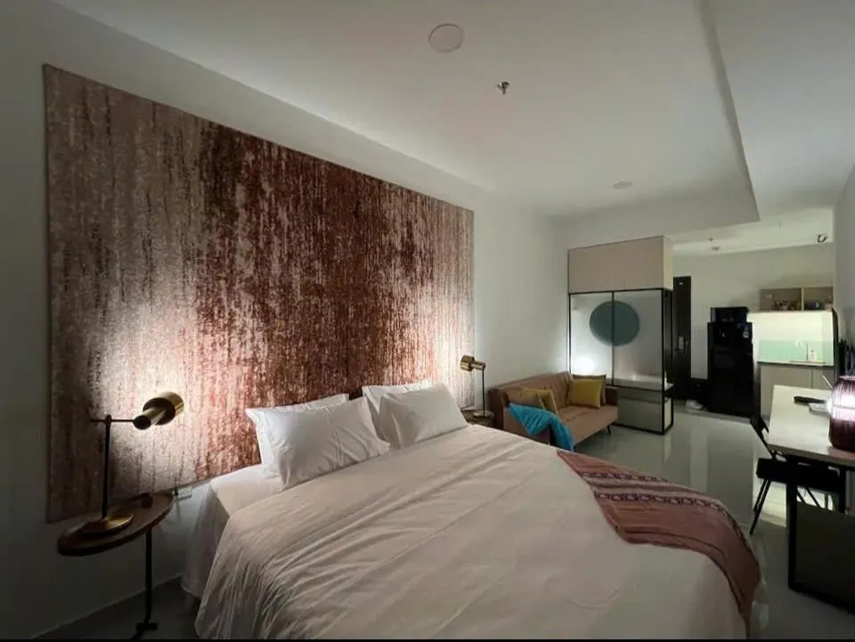 Bed in Otis Soho Saigon Balcony Apartment