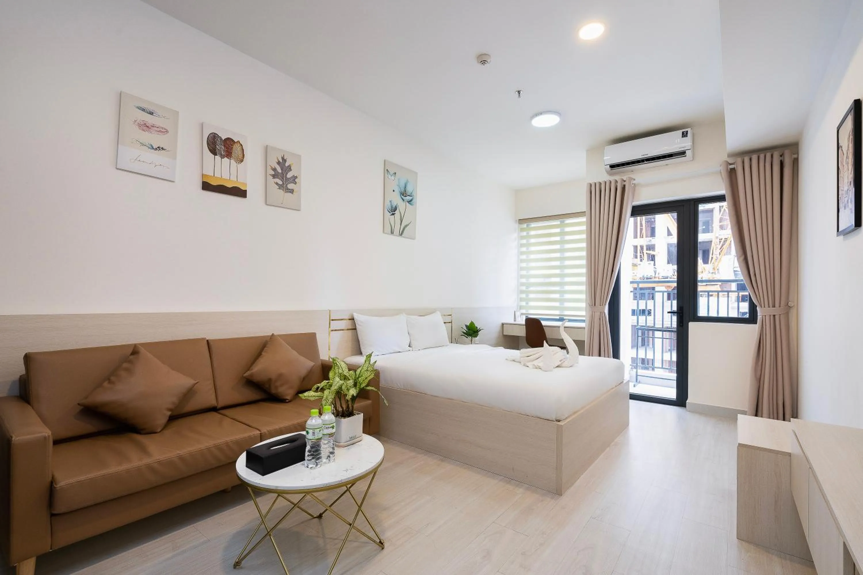 Bed in Otis Soho Saigon Balcony Apartment