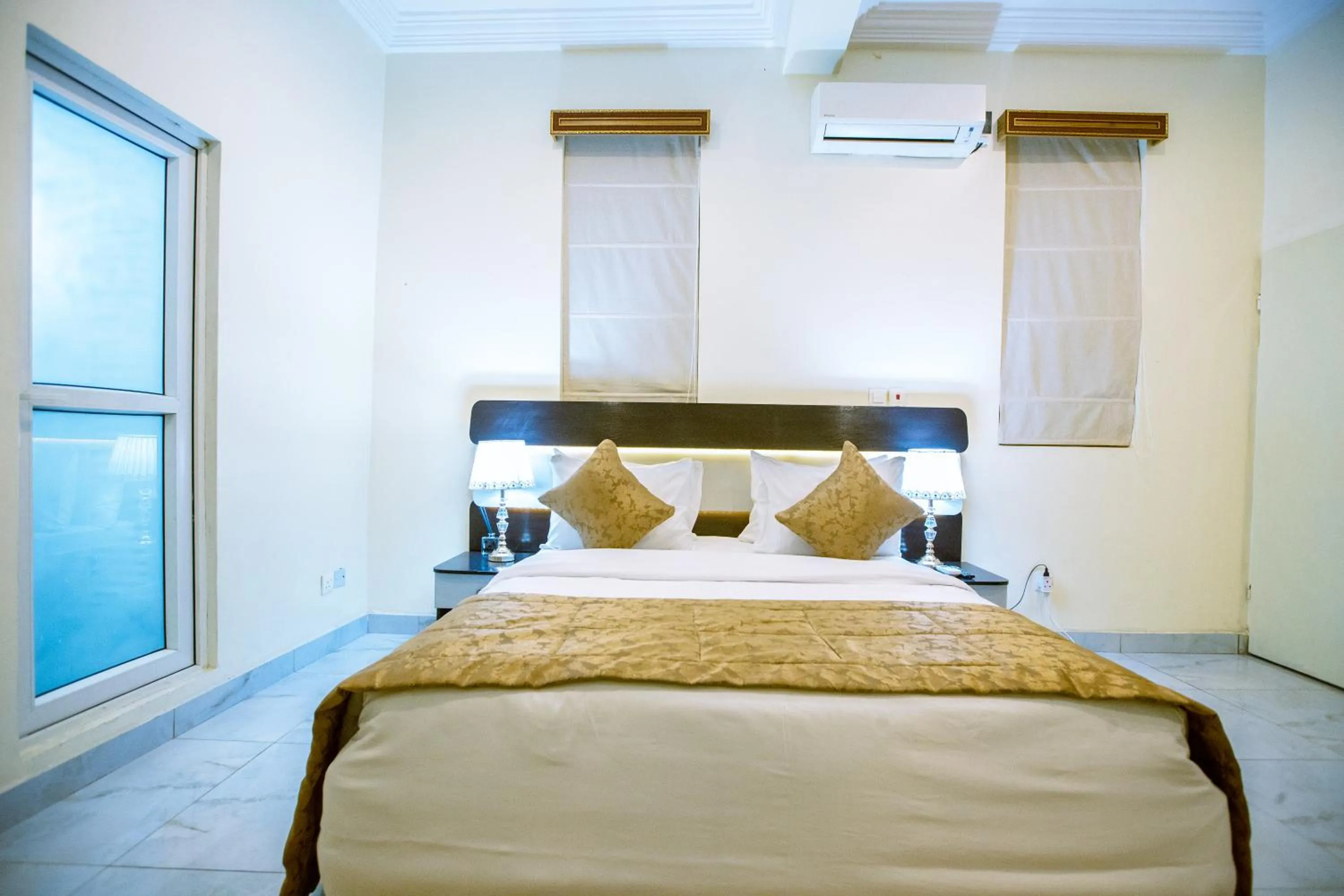 Bed in Providha Hotel & Suites