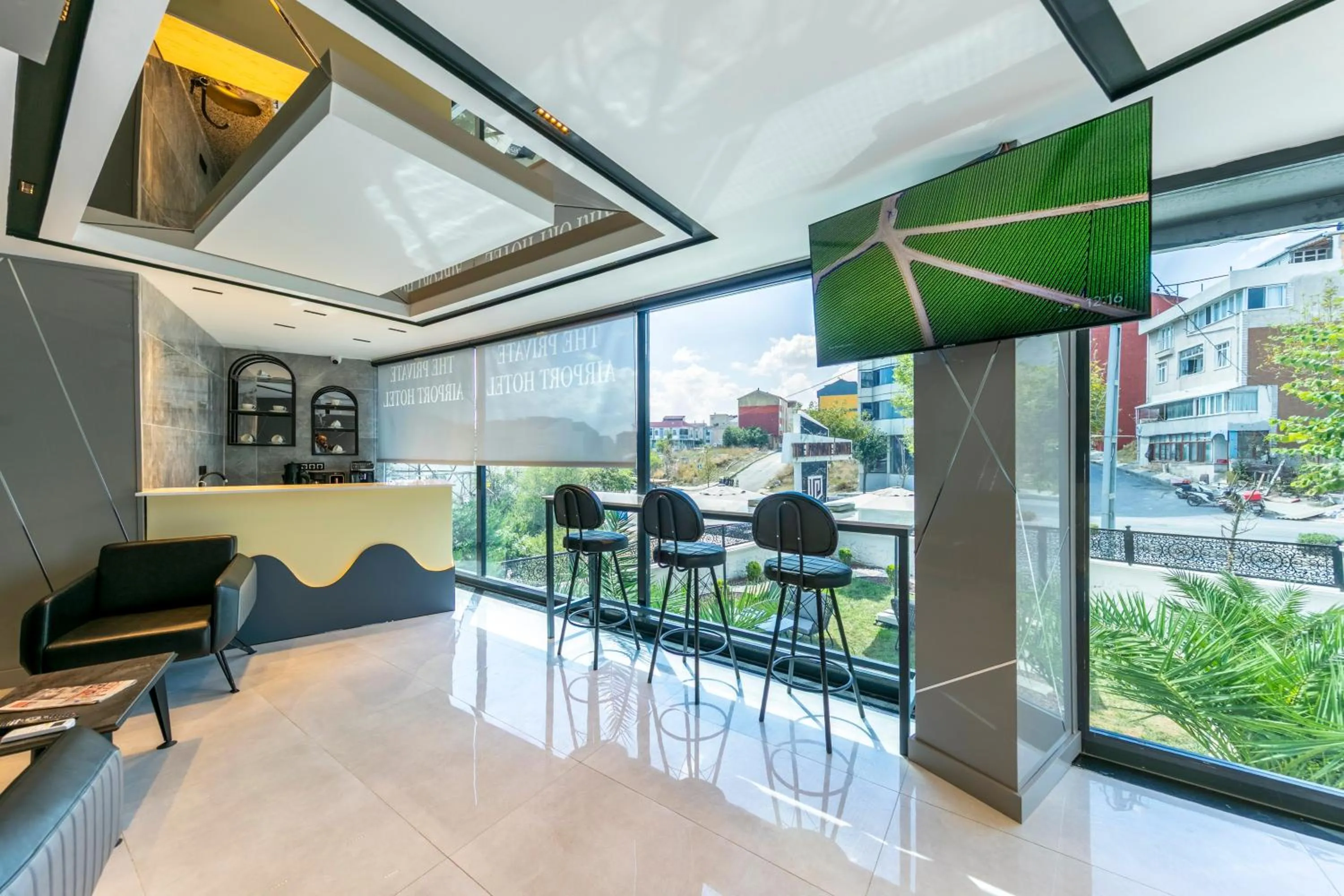 Communal lounge/ TV room in The Private Airport Hotel