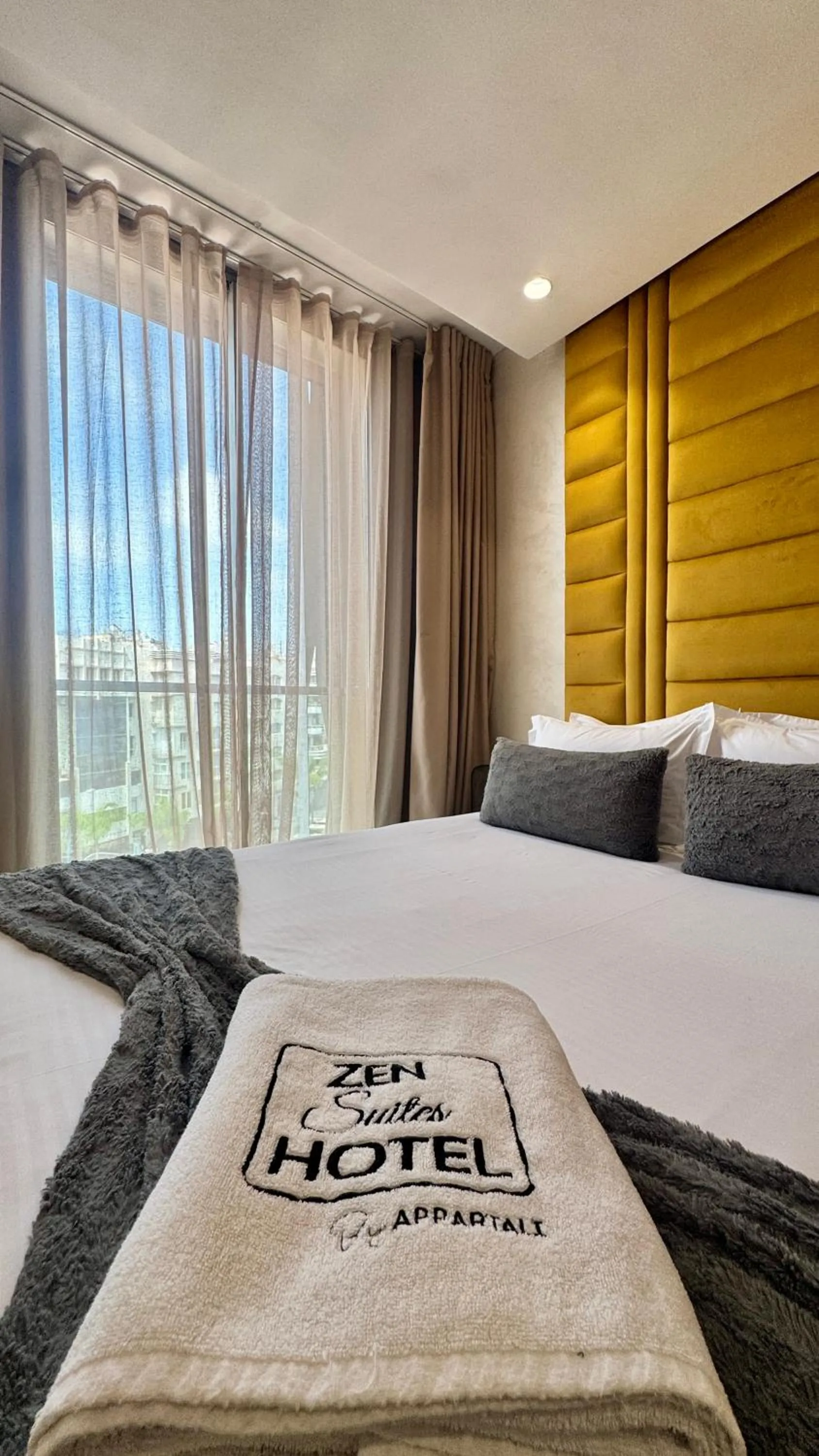 towels, Bed in ZEN Suites Hotel Massira